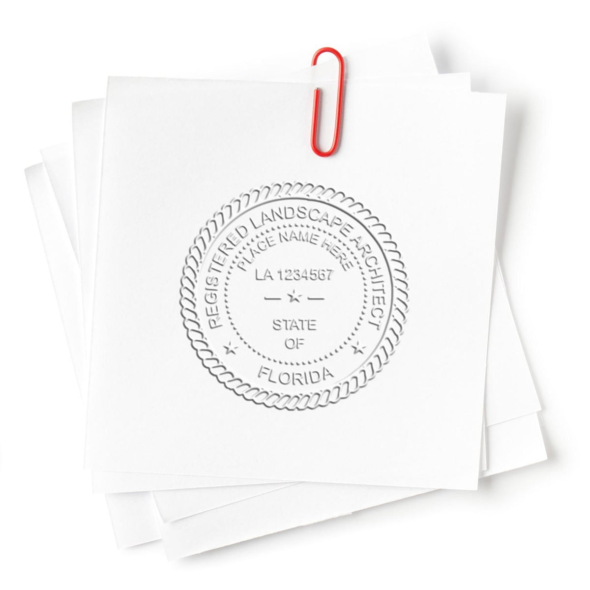 An in use photo of the Gift Florida Landscape Architect Seal showing a sample imprint on a cardstock