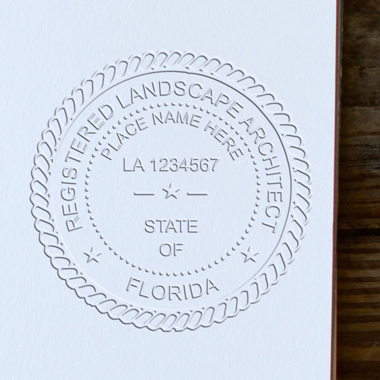 A stamped impression of the State of Florida Handheld Landscape Architect Seal in this stylish lifestyle photo, setting the tone for a unique and personalized product.