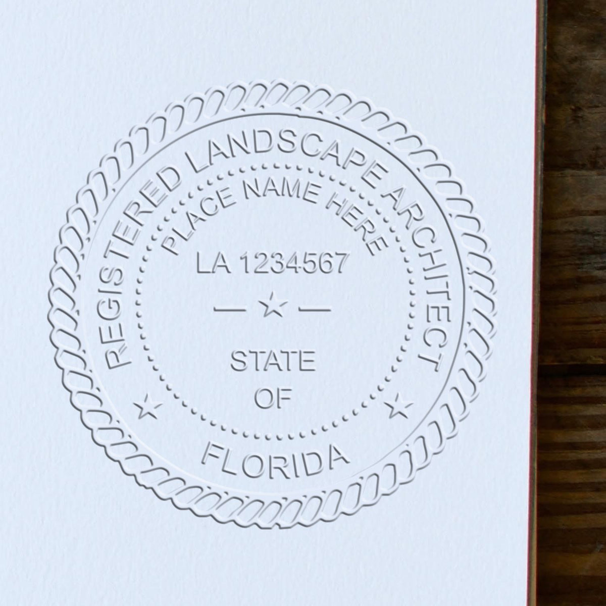 A photograph of the Hybrid Florida Landscape Architect Seal stamp impression reveals a vivid, professional image of the on paper.