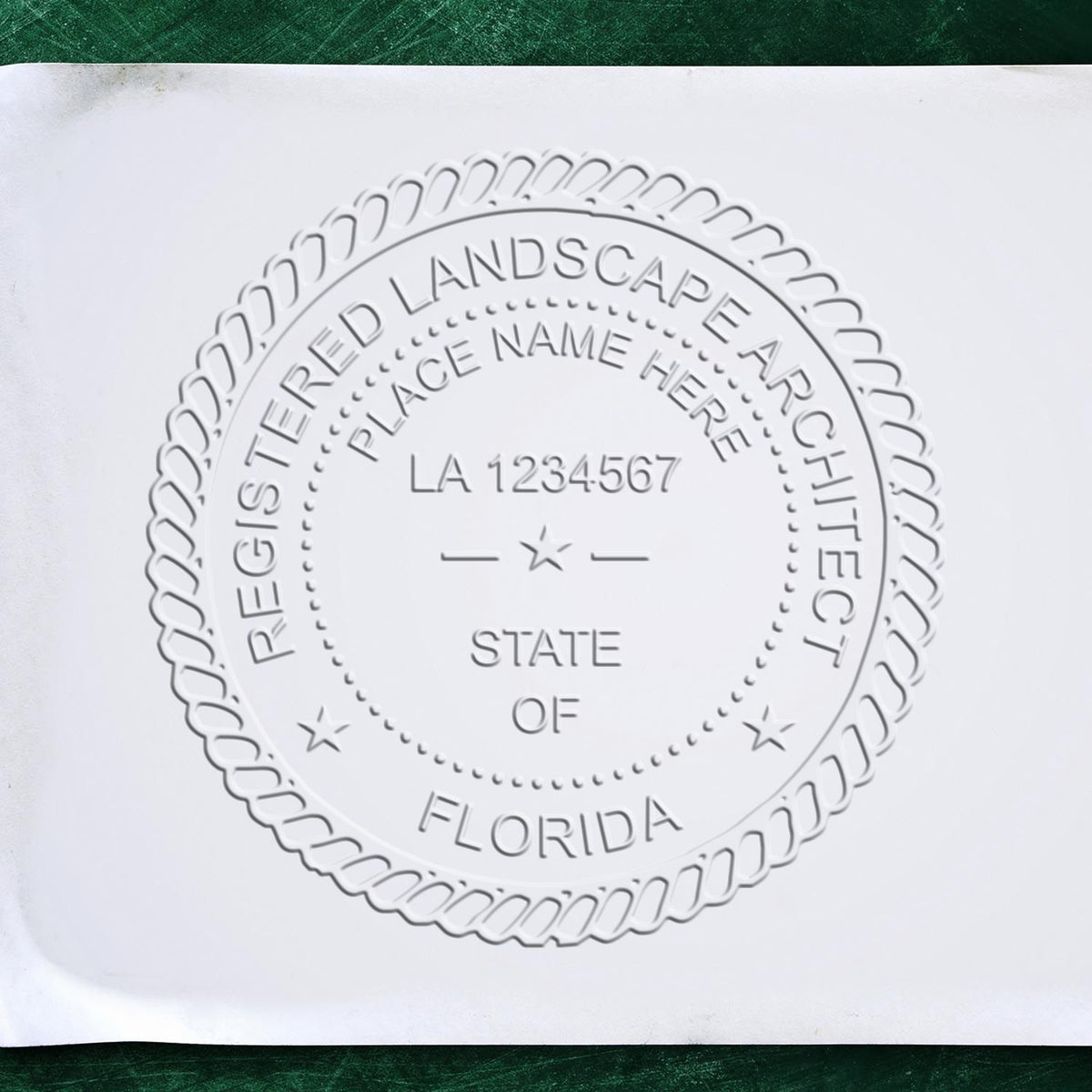 A stamped impression of the Soft Pocket Florida Landscape Architect Embosser in this stylish lifestyle photo, setting the tone for a unique and personalized product.