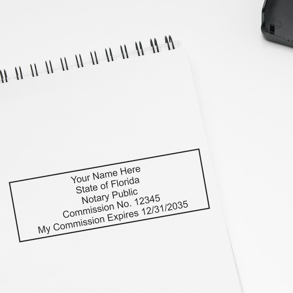 The Slim Pre-Inked Rectangular Notary Stamp for Florida stamp impression comes to life with a crisp, detailed photo on paper - showcasing true professional quality.