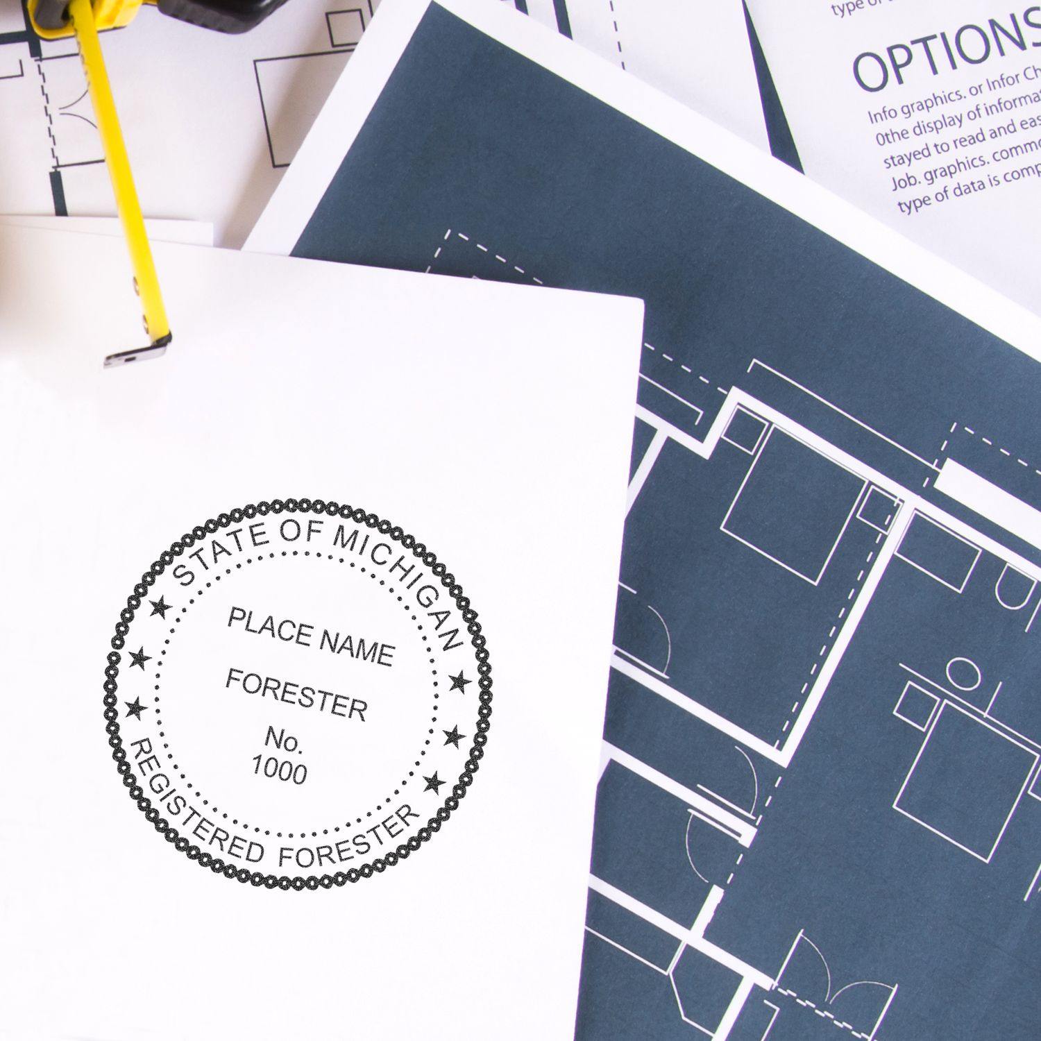 Forester MaxLight Pre Inked Rubber Stamp of Seal used on a document, with architectural blueprints in the background.