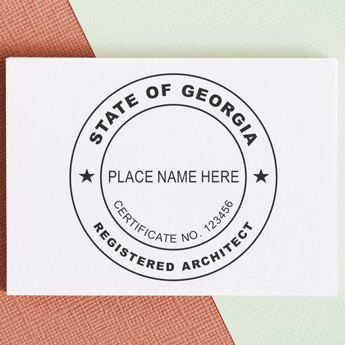 A lifestyle photo showing a stamped image of the Slim Pre-Inked Georgia Architect Seal Stamp on a piece of paper