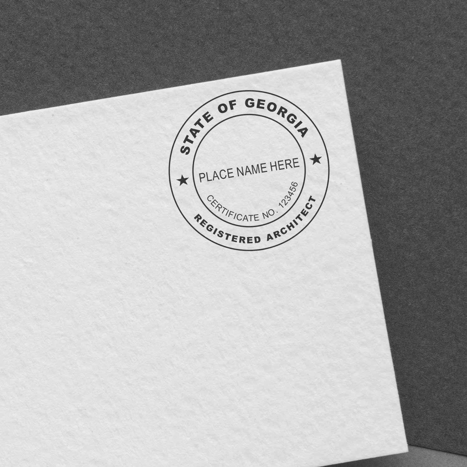 Self Inking Georgia Architect Stamp imprint on white paper, showing a circular design with space for name and certification number.