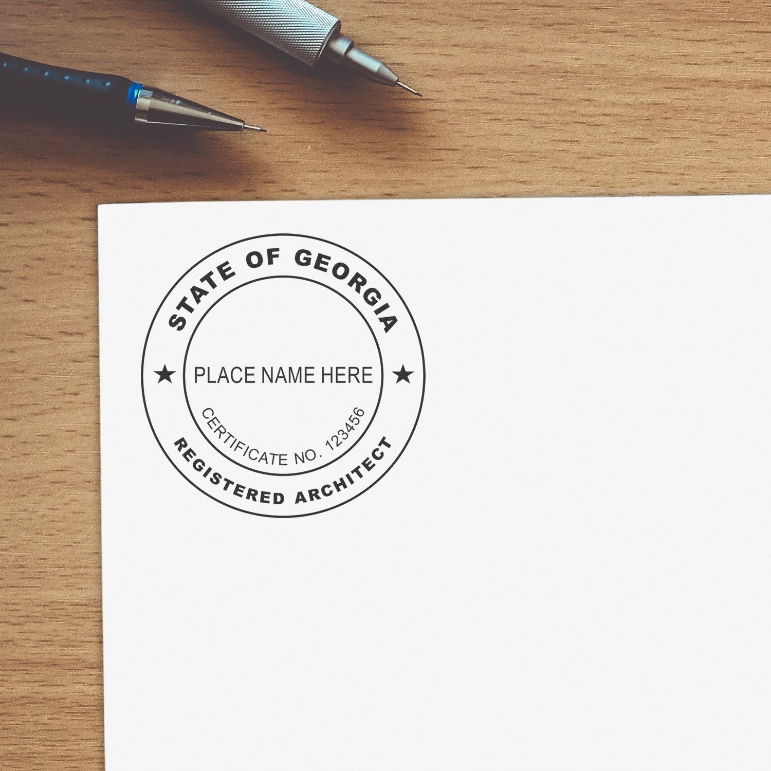 Digital Georgia Architect Stamp, Electronic Seal for Georgia Architect, displayed on a white paper with a pen and pencil nearby.