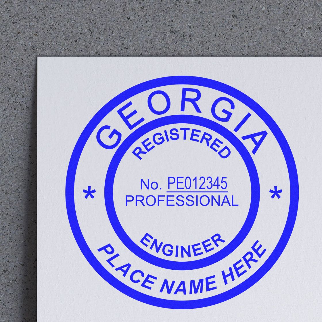 A lifestyle photo showing a stamped image of the Premium MaxLight Pre-Inked Georgia Engineering Stamp on a piece of paper