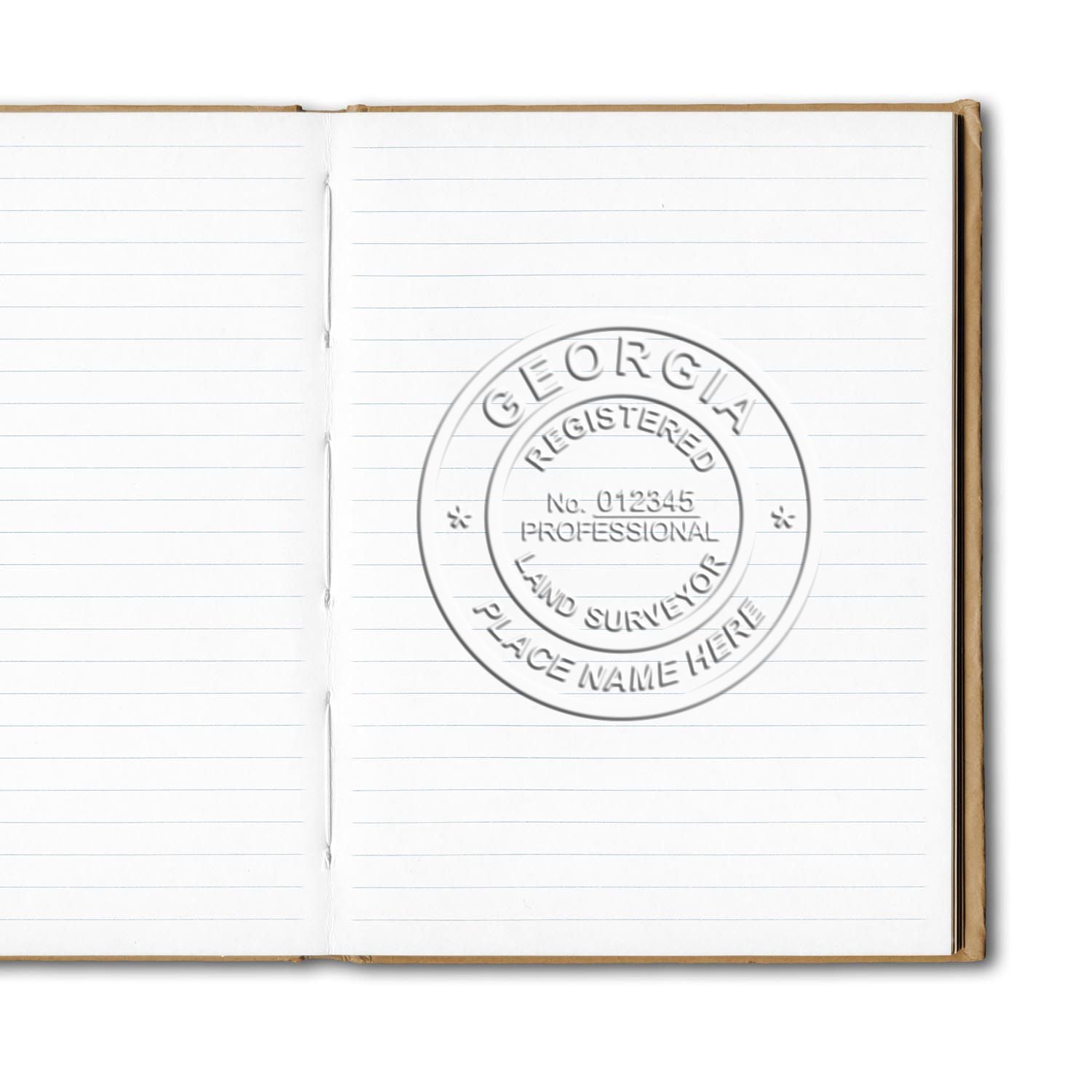 An in use photo of the Gift Georgia Land Surveyor Seal showing a sample imprint on a cardstock