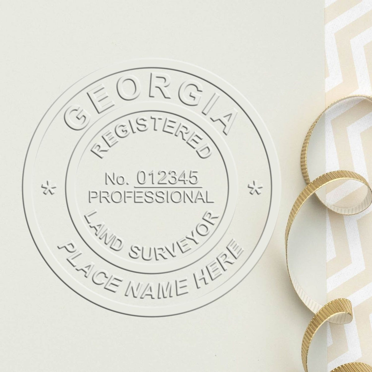 A lifestyle photo showing a stamped image of the State of Georgia Soft Land Surveyor Embossing Seal on a piece of paper