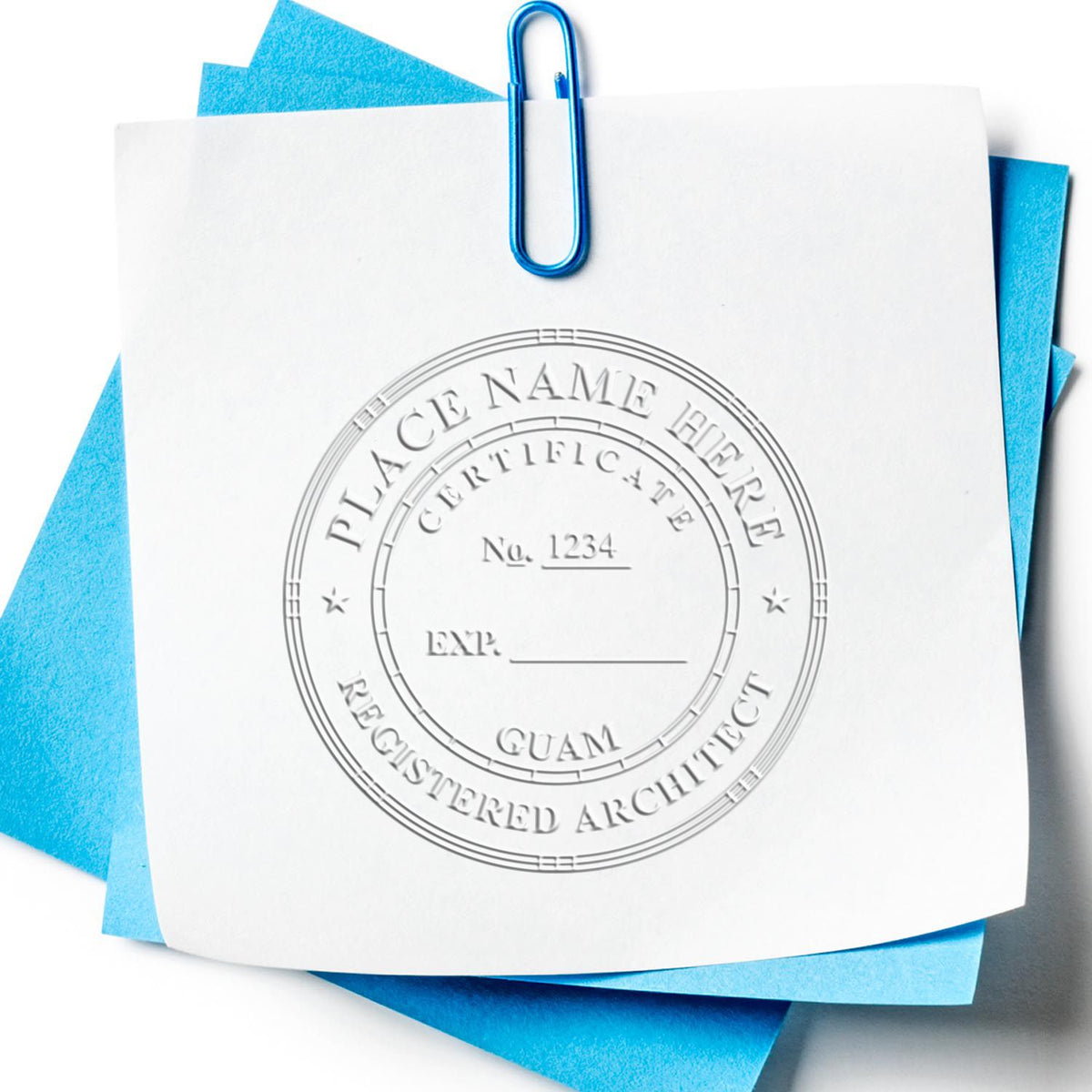 A lifestyle photo showing a stamped image of the Handheld Guam Architect Seal Embosser on a piece of paper