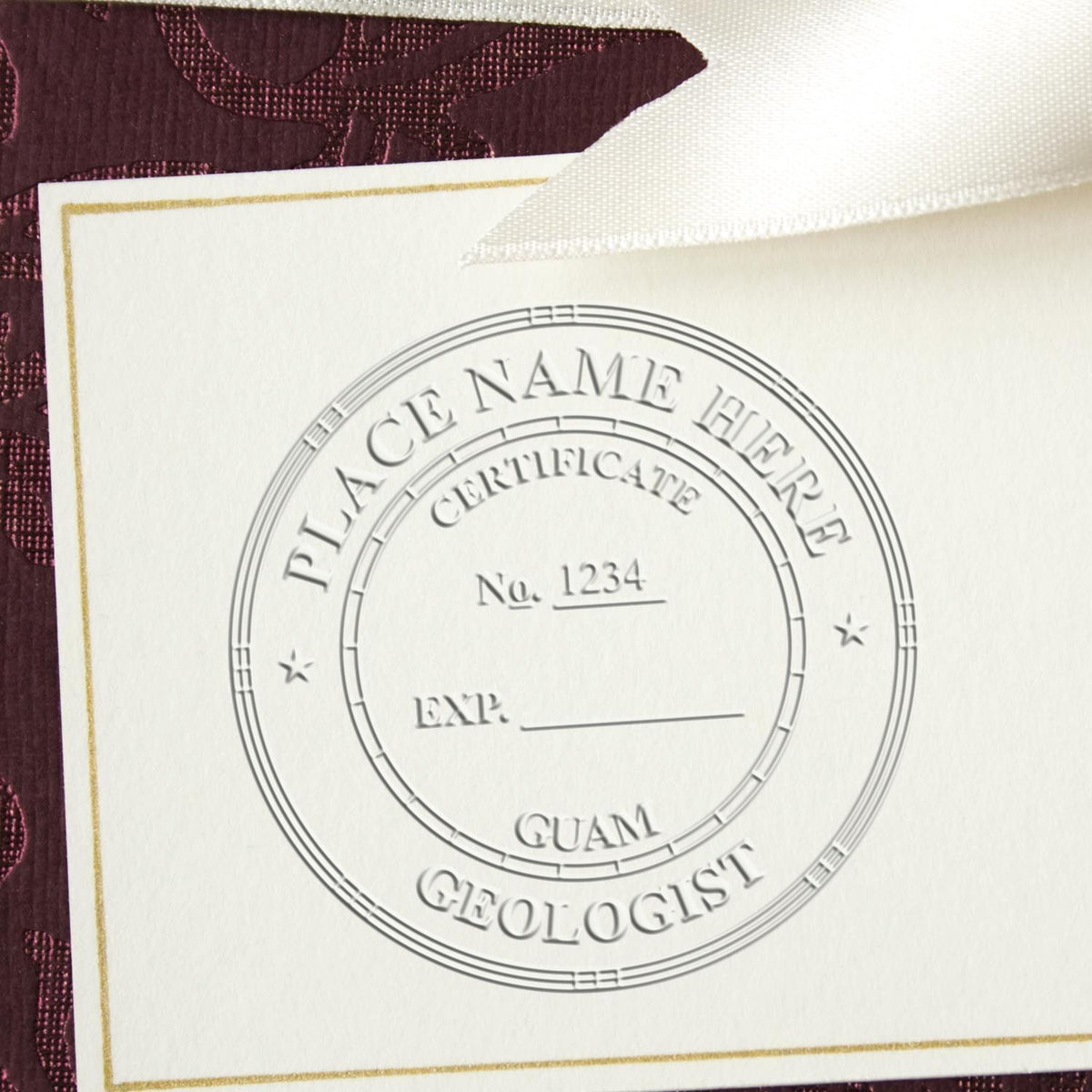 An in use photo of the Soft Guam Professional Geologist Seal showing a sample imprint on a cardstock