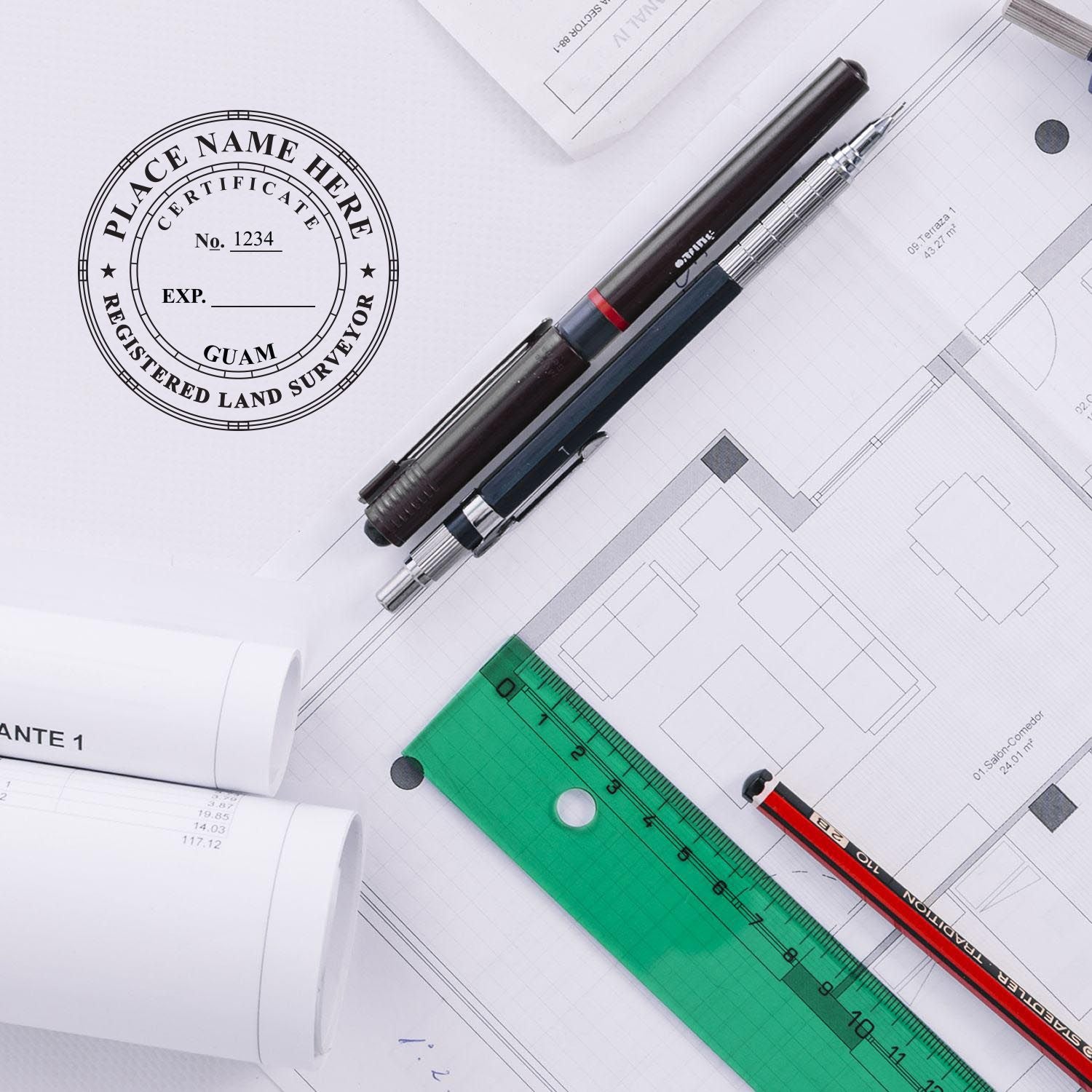 Self Inking Guam Land Surveyor Stamp in use on architectural plans, surrounded by pens, ruler, and rolled blueprints.