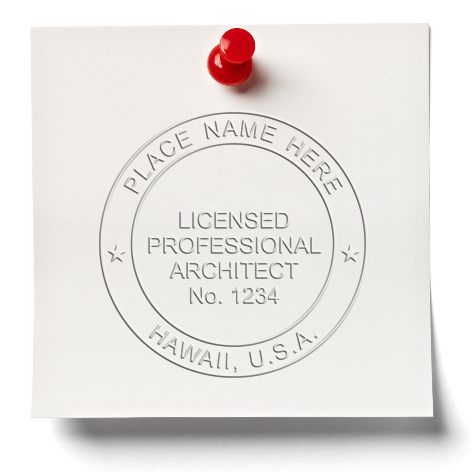 A lifestyle photo showing a stamped image of the Handheld Hawaii Architect Seal Embosser on a piece of paper