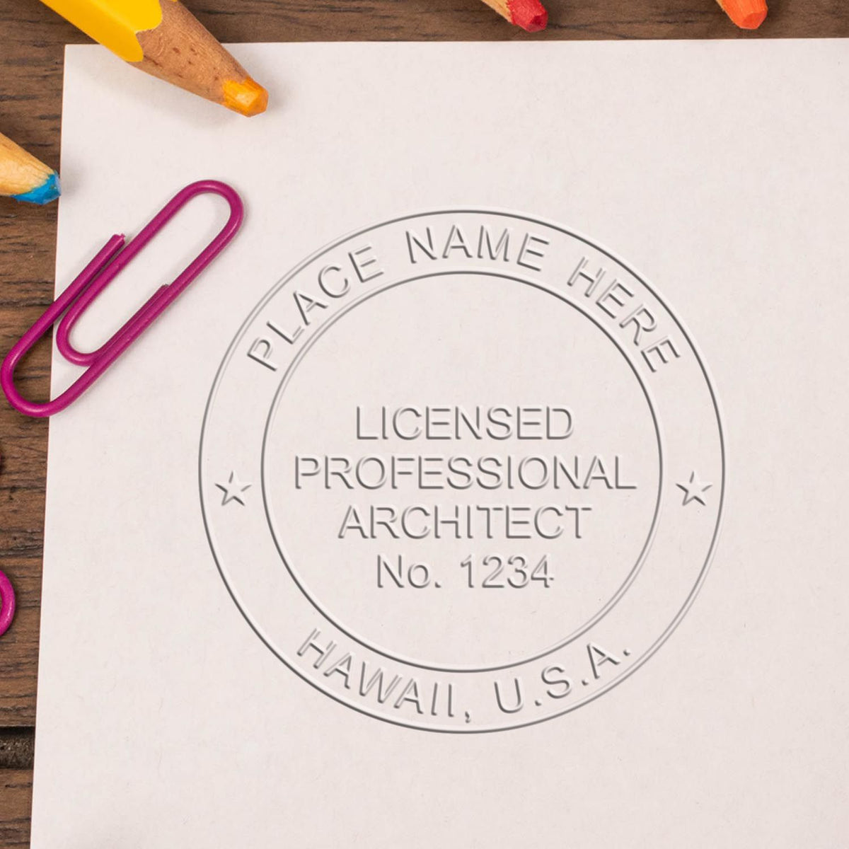 A lifestyle photo showing a stamped image of the Hawaii Desk Architect Embossing Seal on a piece of paper
