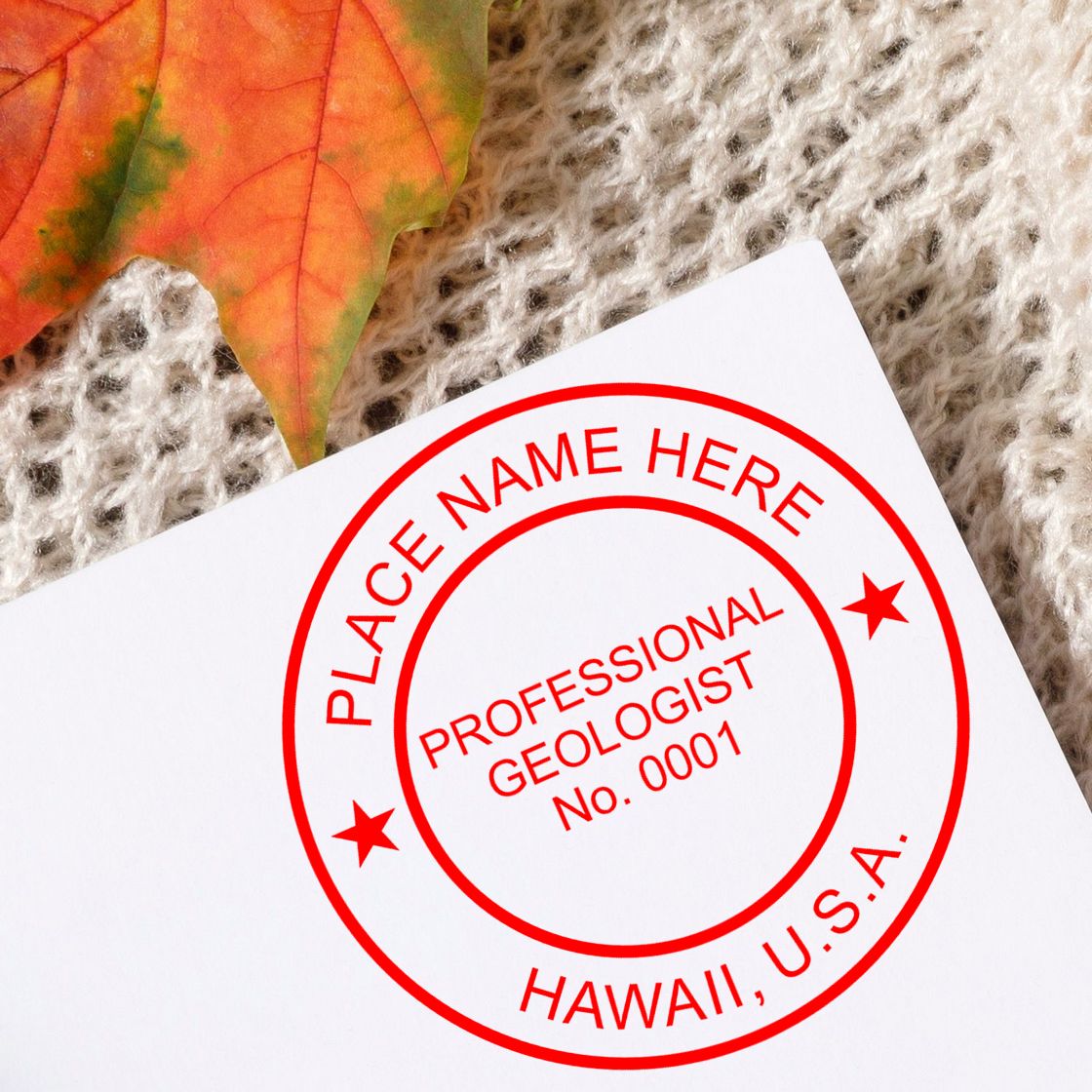 An in use photo of the Premium MaxLight Pre-Inked Hawaii Geology Stamp showing a sample imprint on a cardstock