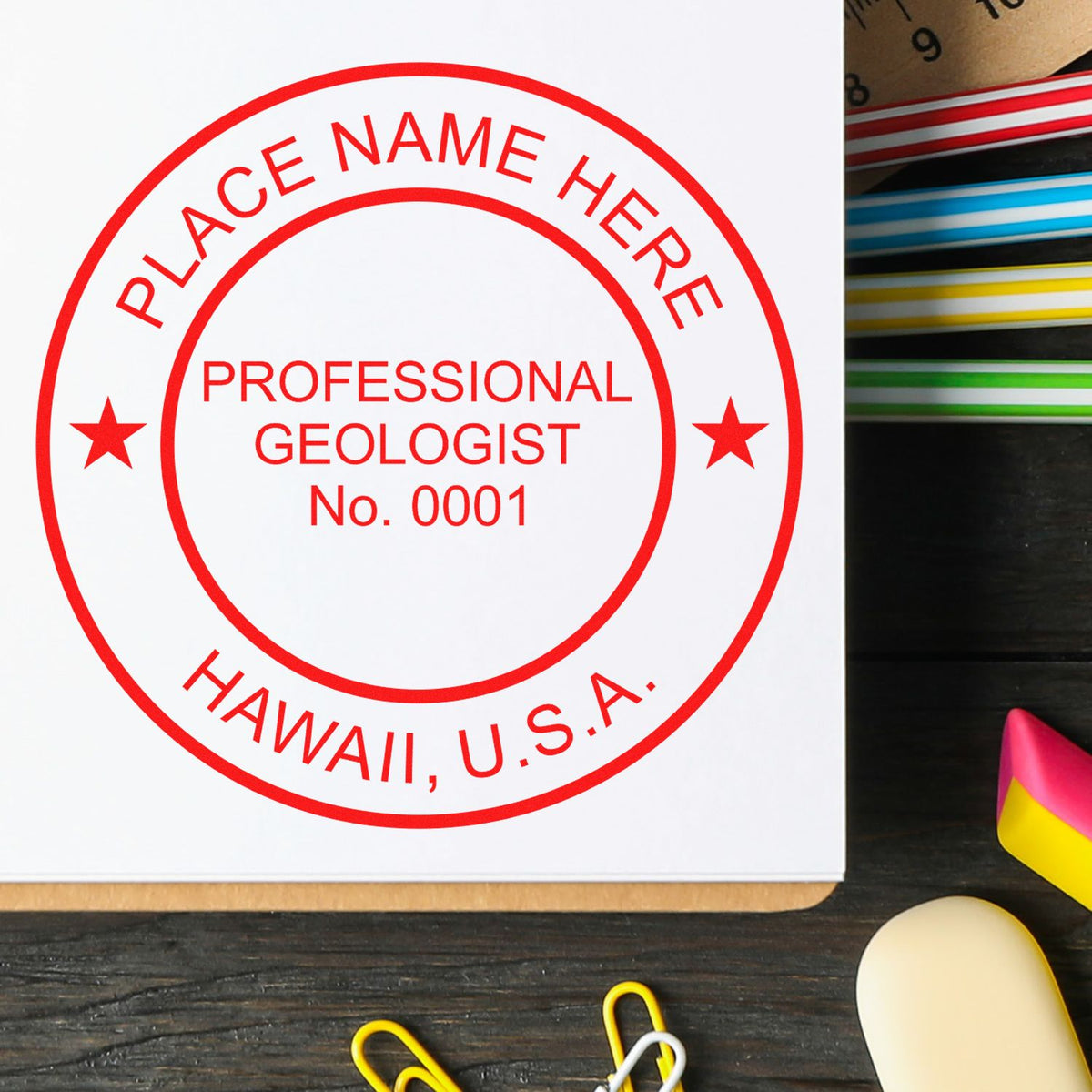 An in use photo of the Slim Pre-Inked Hawaii Professional Geologist Seal Stamp showing a sample imprint on a cardstock
