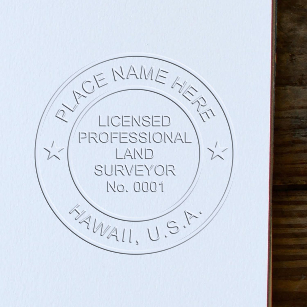 A lifestyle photo showing a stamped image of the State of Hawaii Soft Land Surveyor Embossing Seal on a piece of paper
