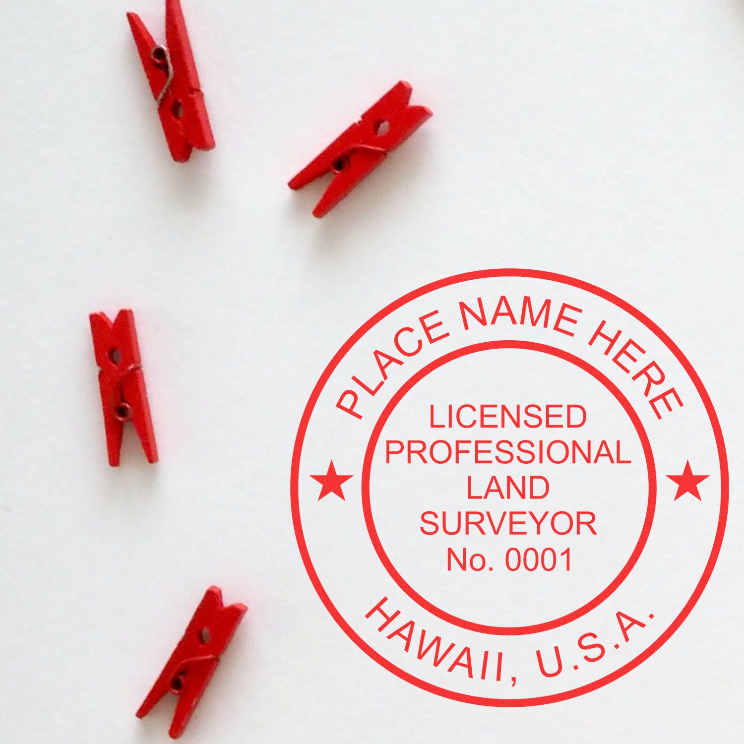 Hawaii Land Surveyor Seal Stamp, HI PLS Stamp in red ink on white paper with four small red clothespins.