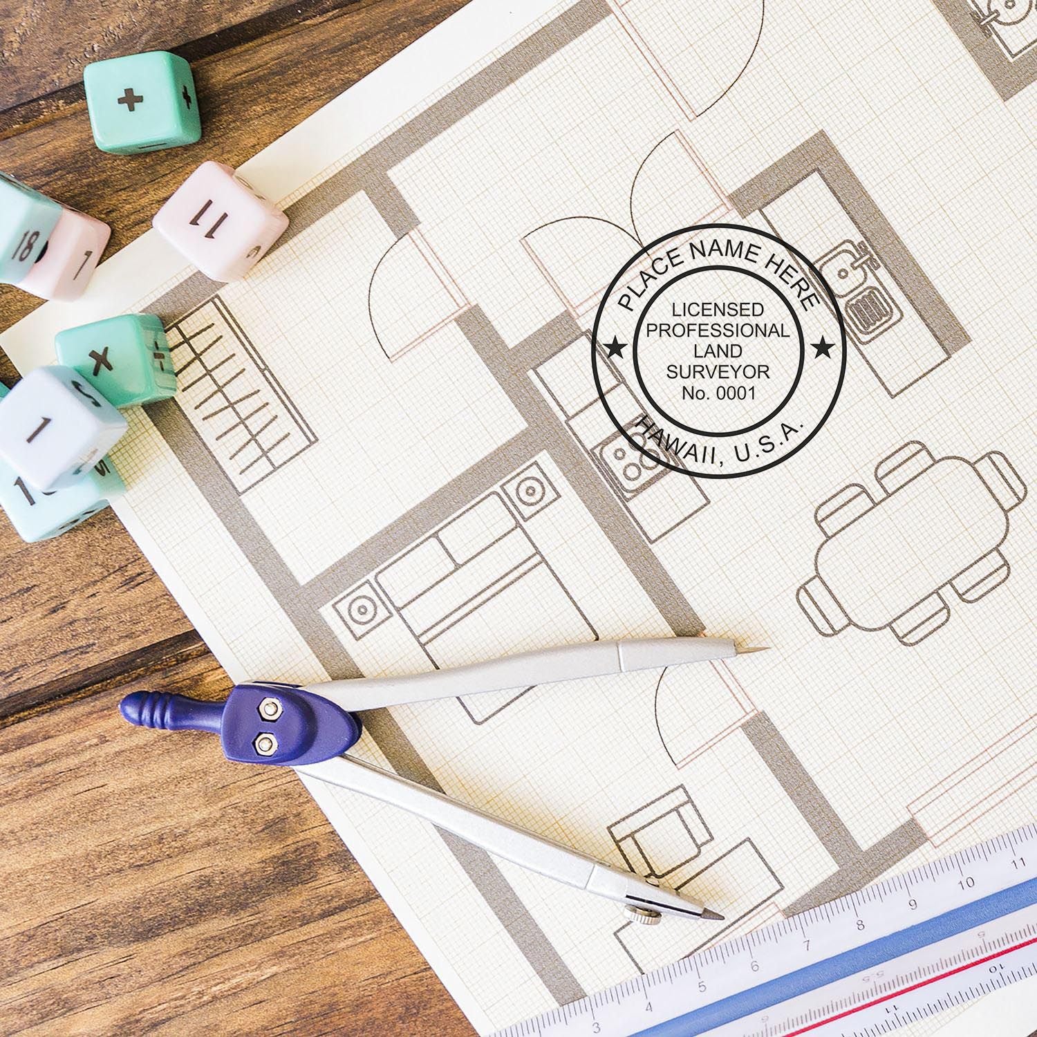 Self Inking Hawaii Land Surveyor Stamp on a building blueprint with drafting tools and dice on a wooden table.