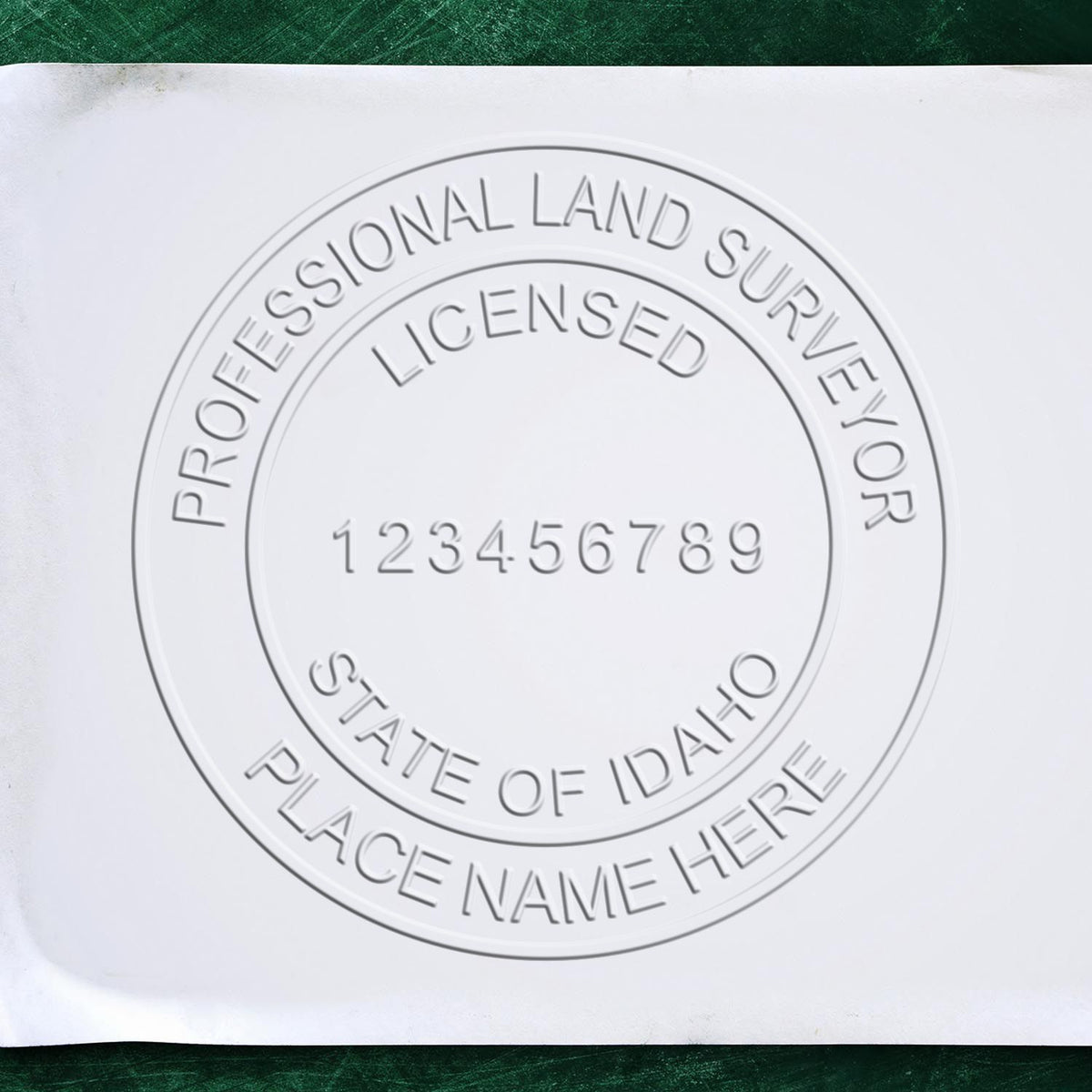 A photograph of the State of Idaho Soft Land Surveyor Embossing Seal stamp impression reveals a vivid, professional image of the on paper.