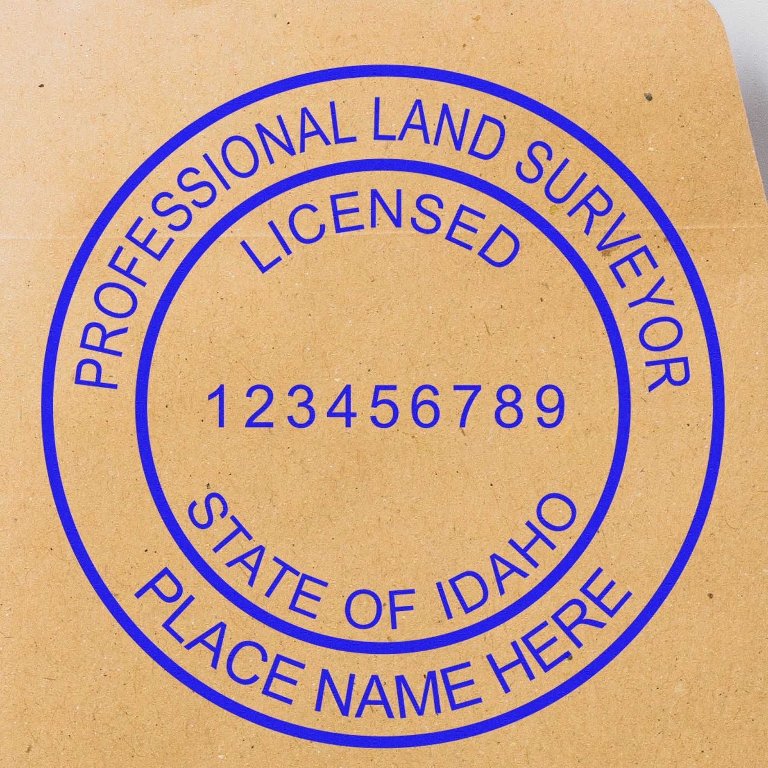 Digital Idaho Land Surveyor Stamp, Electronic Seal for Idaho Land Surveyor, blue ink on brown paper with customizable text fields.