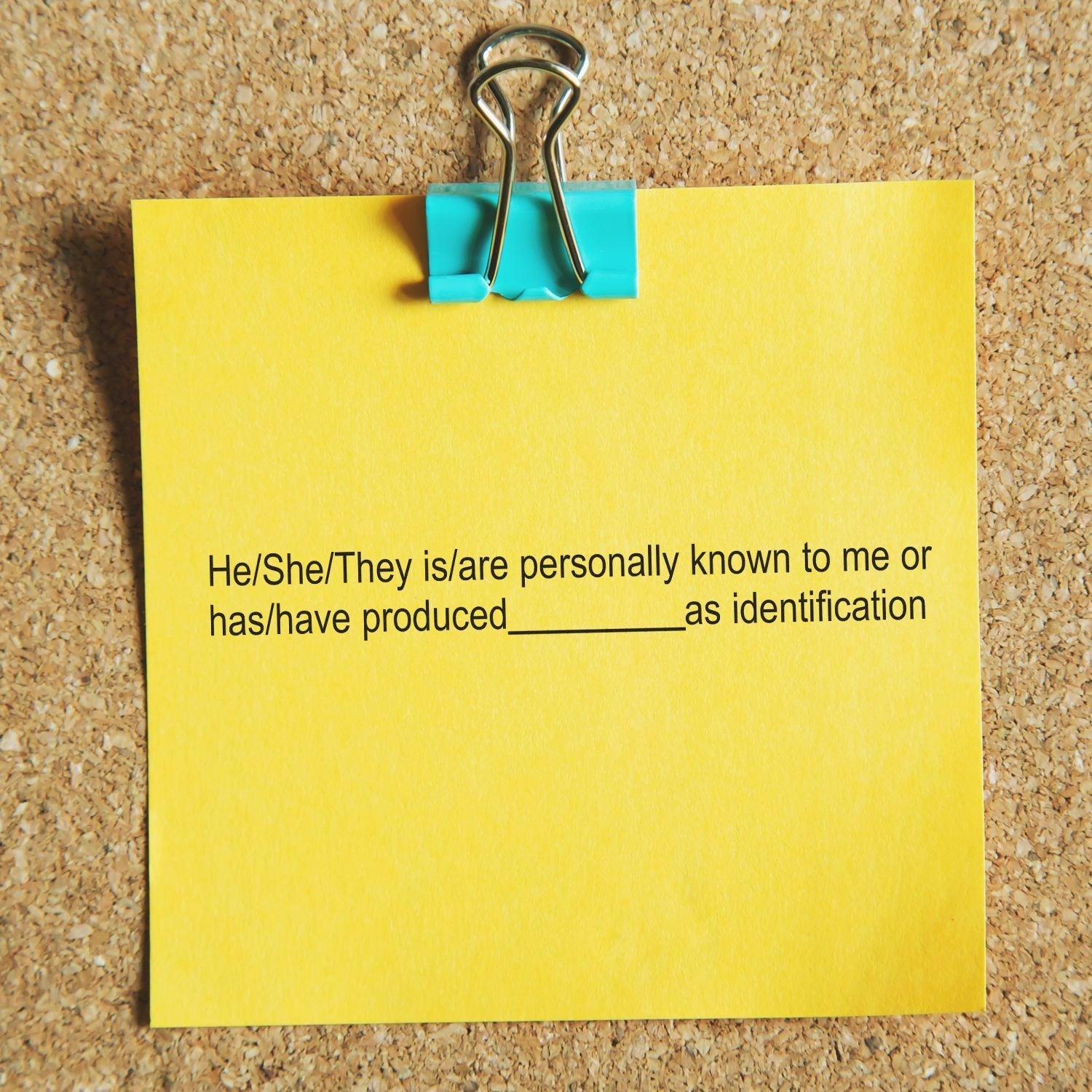 Yellow note on corkboard with text He/She/They is/are personally known to me or has/have produced__________ as identification using MaxLight Pre-Inked Stamp Identification Notary Stamp.