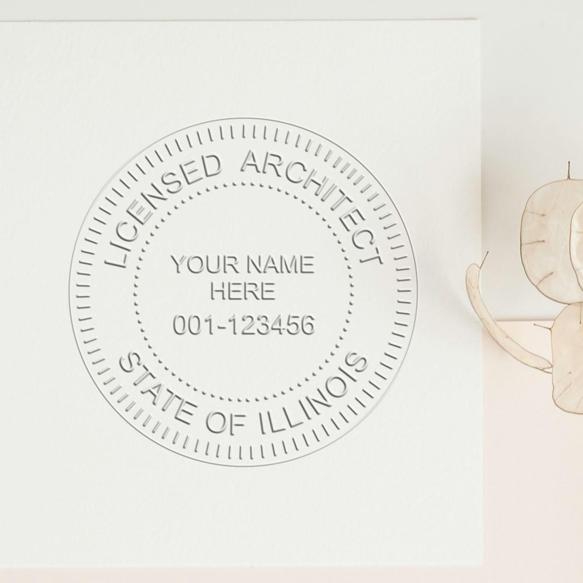 A lifestyle photo showing a stamped image of the Illinois Desk Architect Embossing Seal on a piece of paper