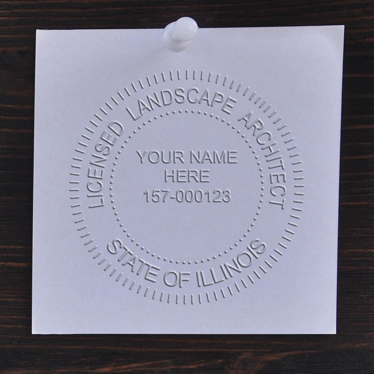 A photograph of the Hybrid Illinois Landscape Architect Seal stamp impression reveals a vivid, professional image of the on paper.