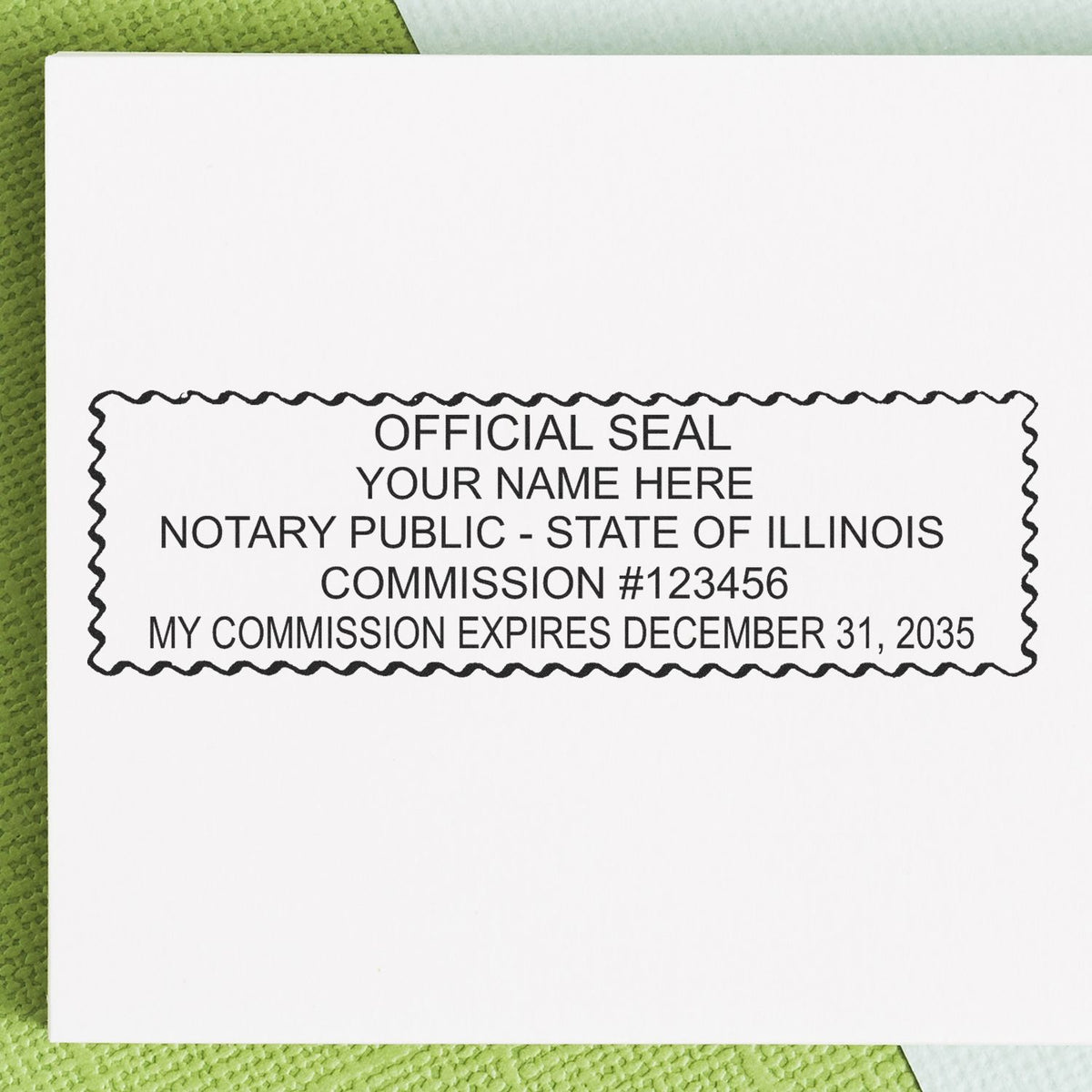 A lifestyle photo showing a stamped image of the Wooden Handle Illinois Rectangular Notary Public Stamp on a piece of paper