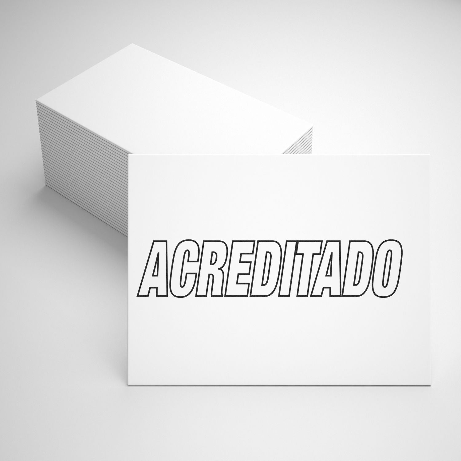 A stack of white cards with ACREDITADO stamped in bold letters using the Self Inking Acreditado Stamp, placed on a white surface.