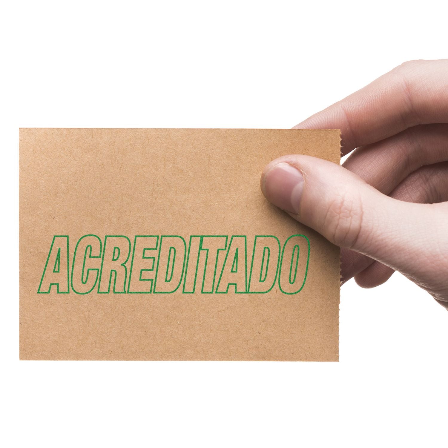 A hand holding a brown card stamped with ACREDITADO in green ink using the Large Acreditado Rubber Stamp.