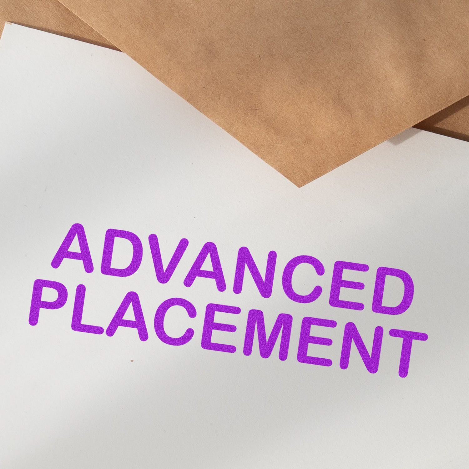 Stamped paper with purple 'ADVANCED PLACEMENT' text using the Self Inking Advanced Placement Stamp, with brown envelopes in the background.