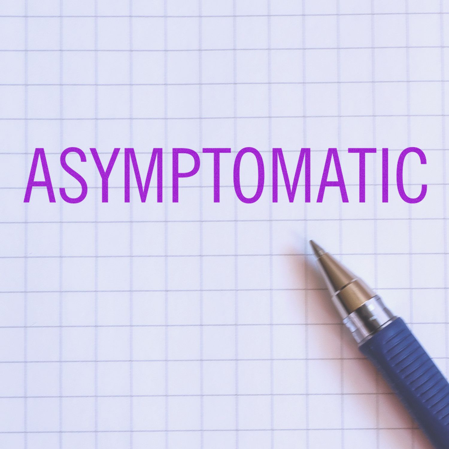 Large Asymptomatic Rubber Stamp in purple ink on graph paper, with a blue pen beside it.