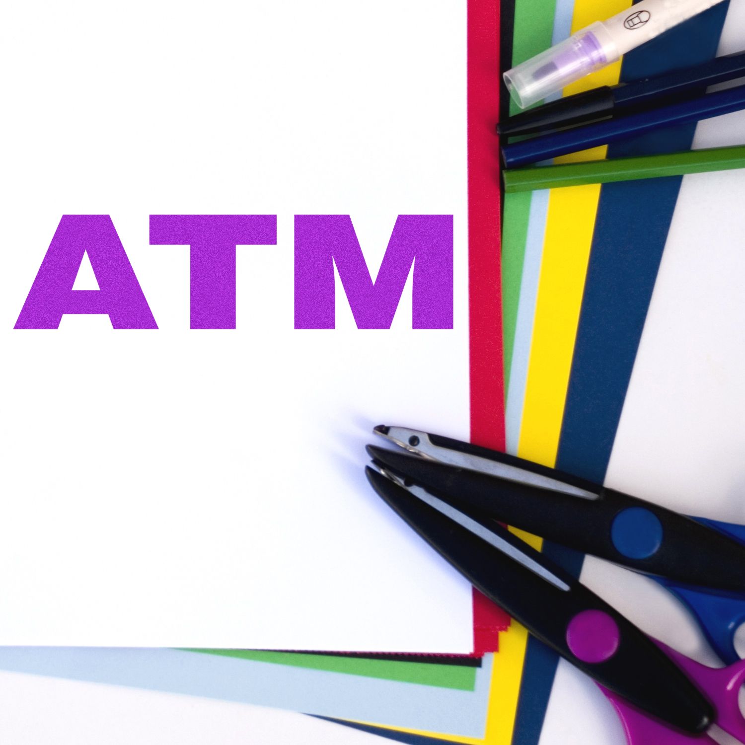 Bank Stamp ATM Rubber Stamp in purple on white paper, surrounded by colorful sheets, scissors, and pens.