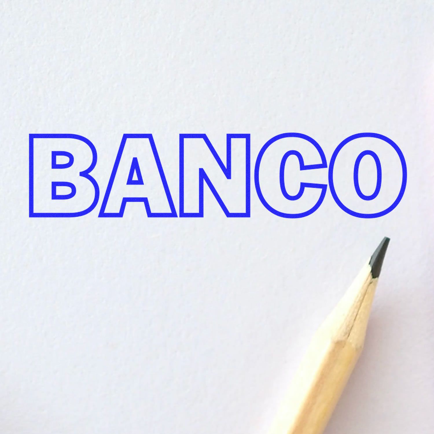 Banco rubber stamp impression in blue ink on white paper, with a sharpened pencil tip visible at the bottom right corner.