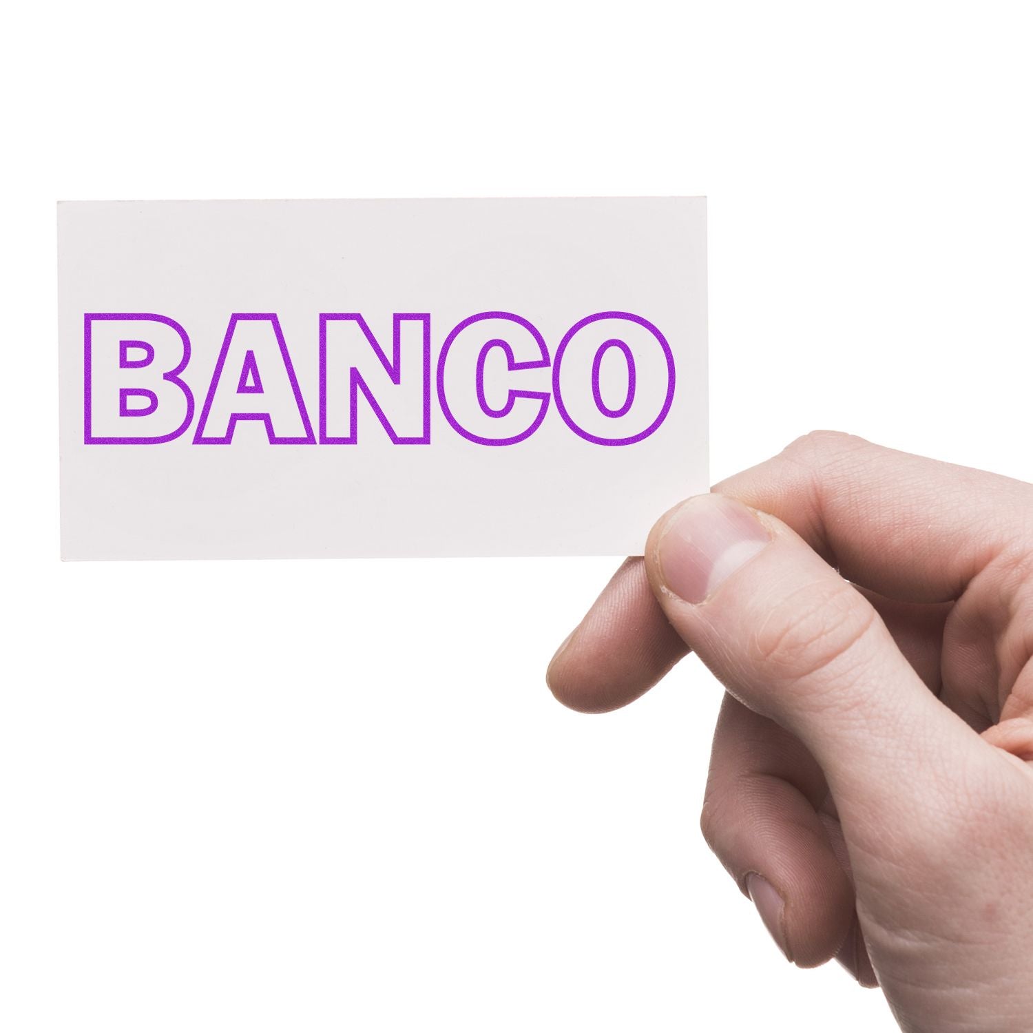 A hand holding a white card stamped with the word BANCO in purple letters using a Banco Rubber Stamp.