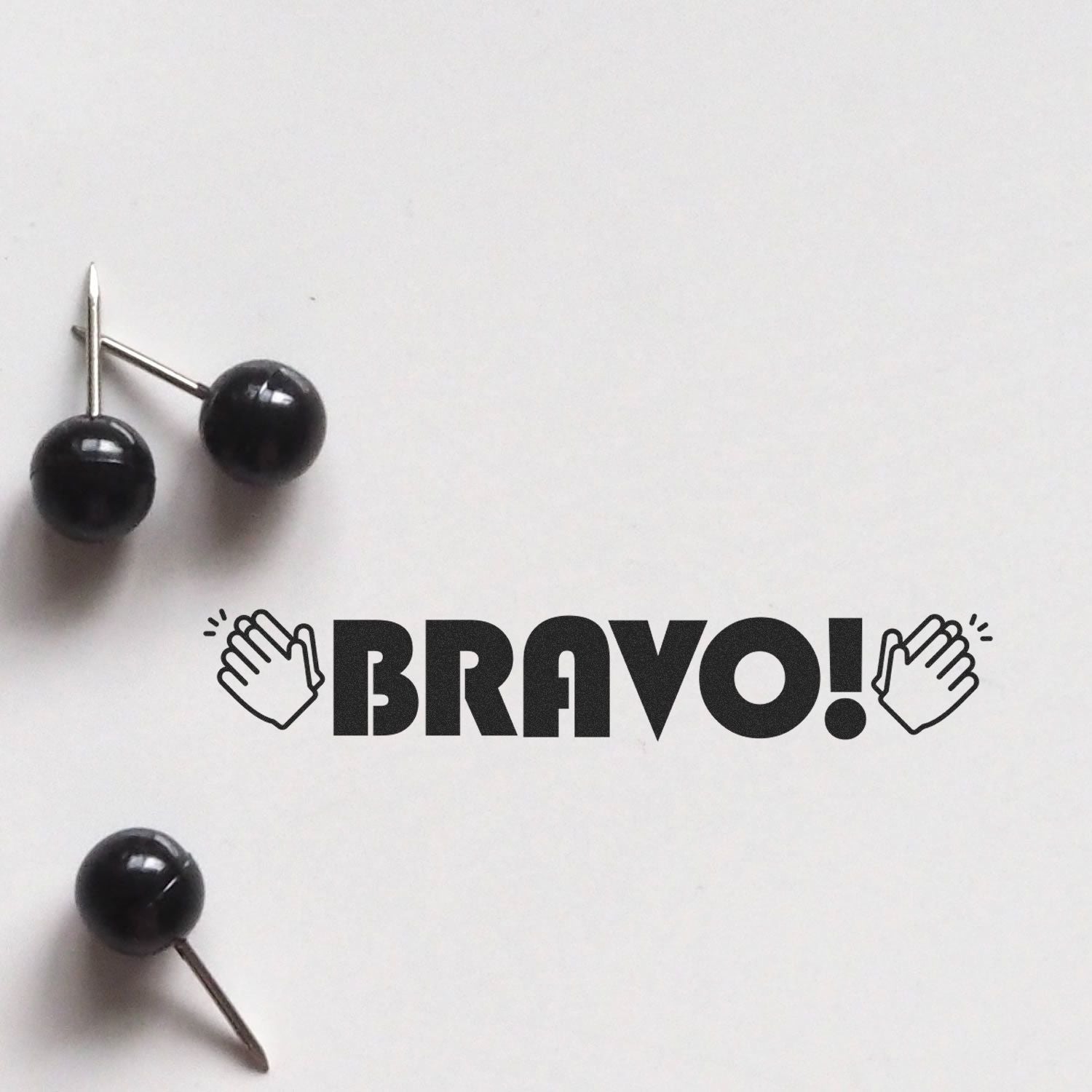 Self Inking Bravo with Hands Stamp in use, displaying the word BRAVO! with clapping hands on a white background.