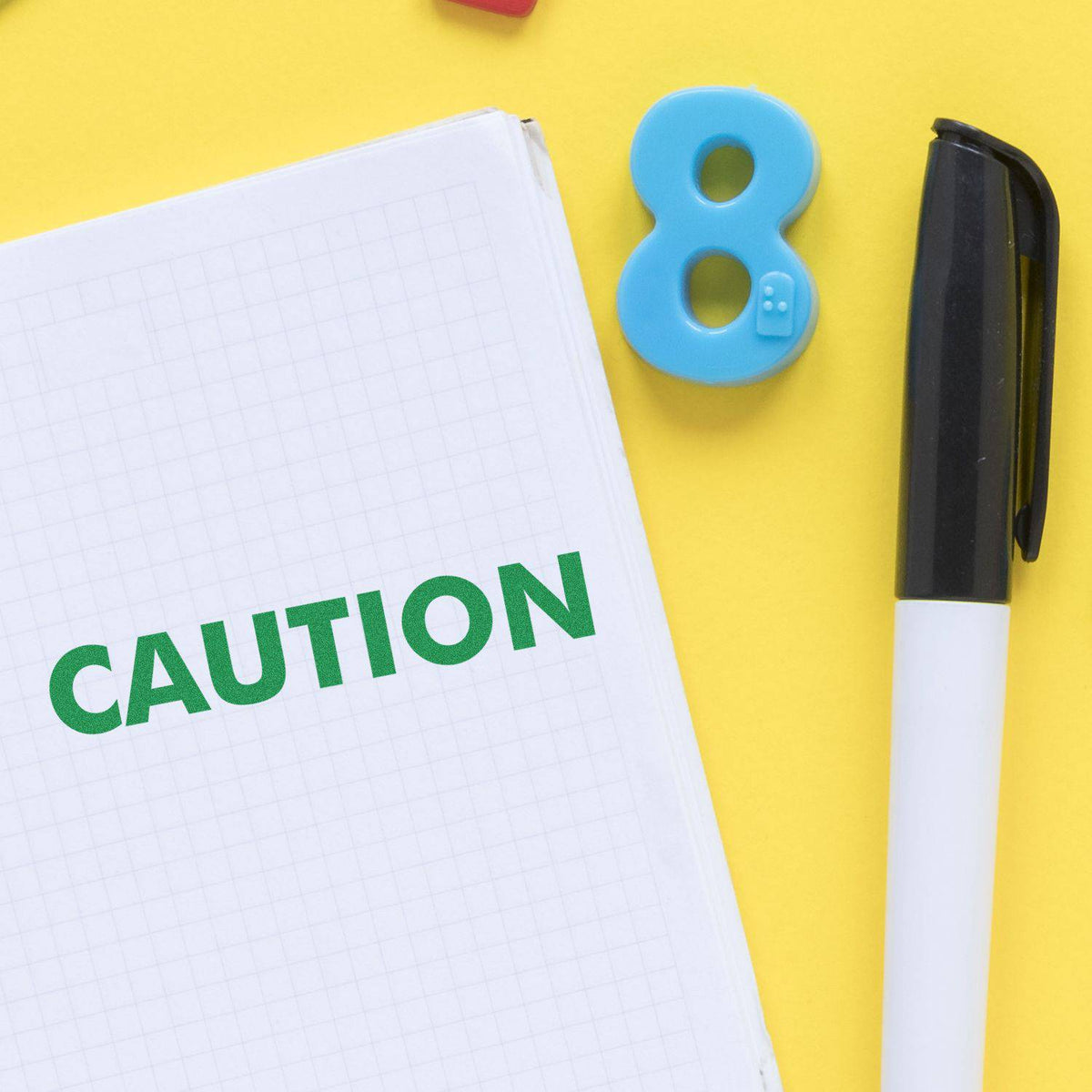 Large Pre-Inked Caution Stamp In Use