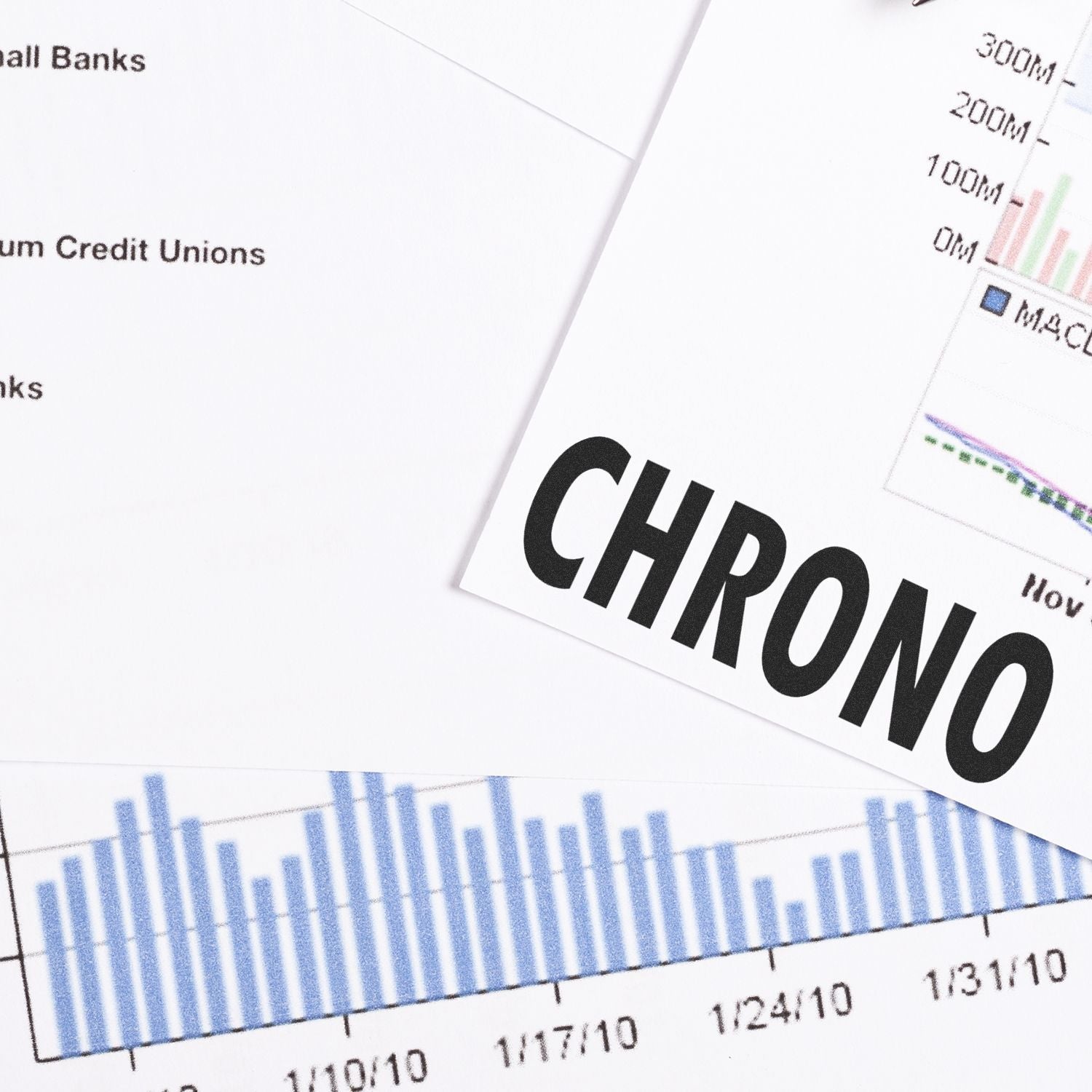 Slim Pre-Inked Chrono Stamp in use on financial documents with charts and graphs, highlighting its precision and clarity.