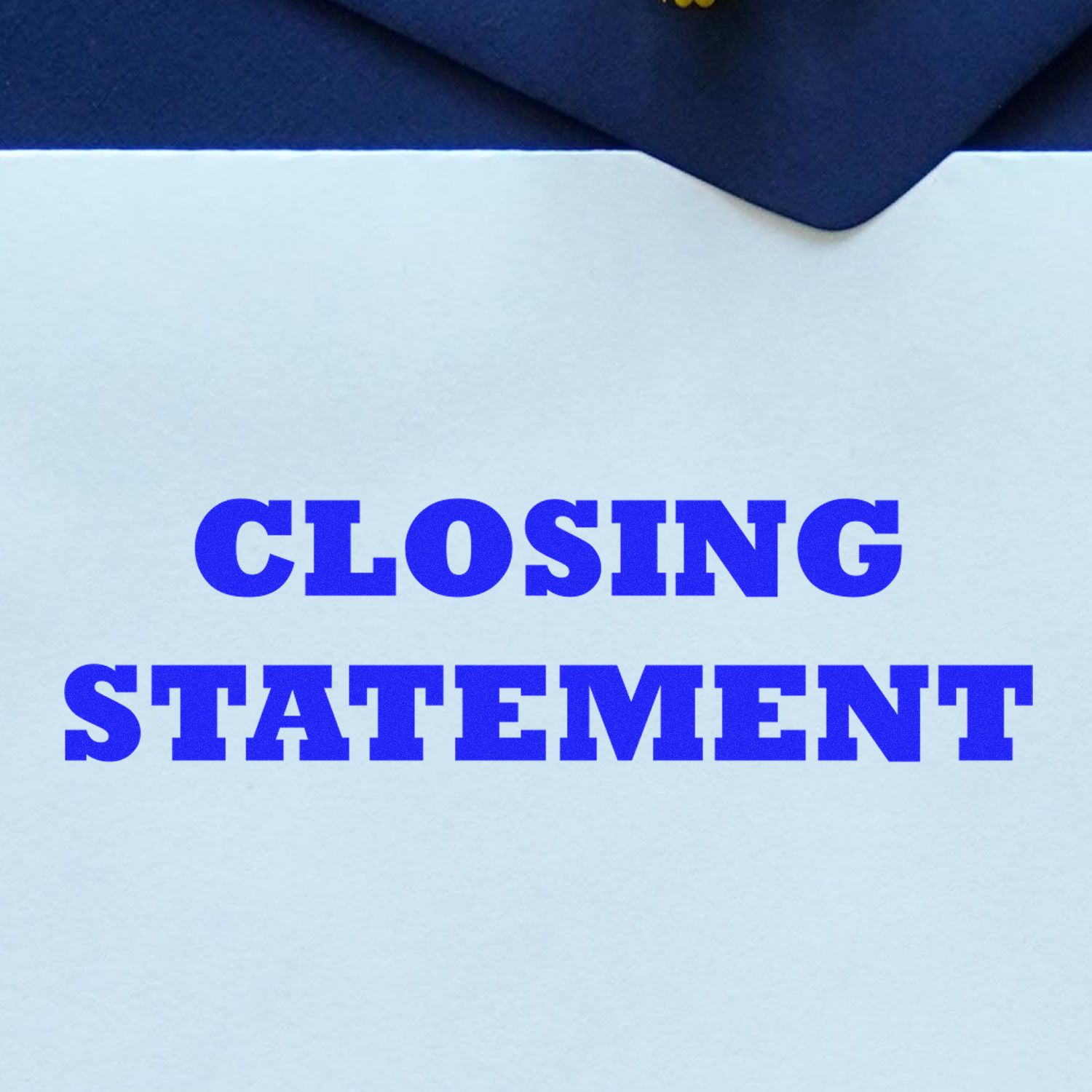 A blue Closing Statement Rubber Stamp imprint on a white paper, with a dark blue envelope partially visible in the background.