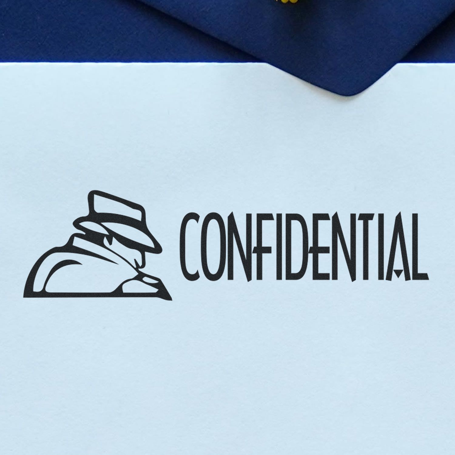 Confidential with Logo Rubber Stamp in use, featuring a silhouette of a person in a hat and coat next to the word CONFIDENTIAL on paper.