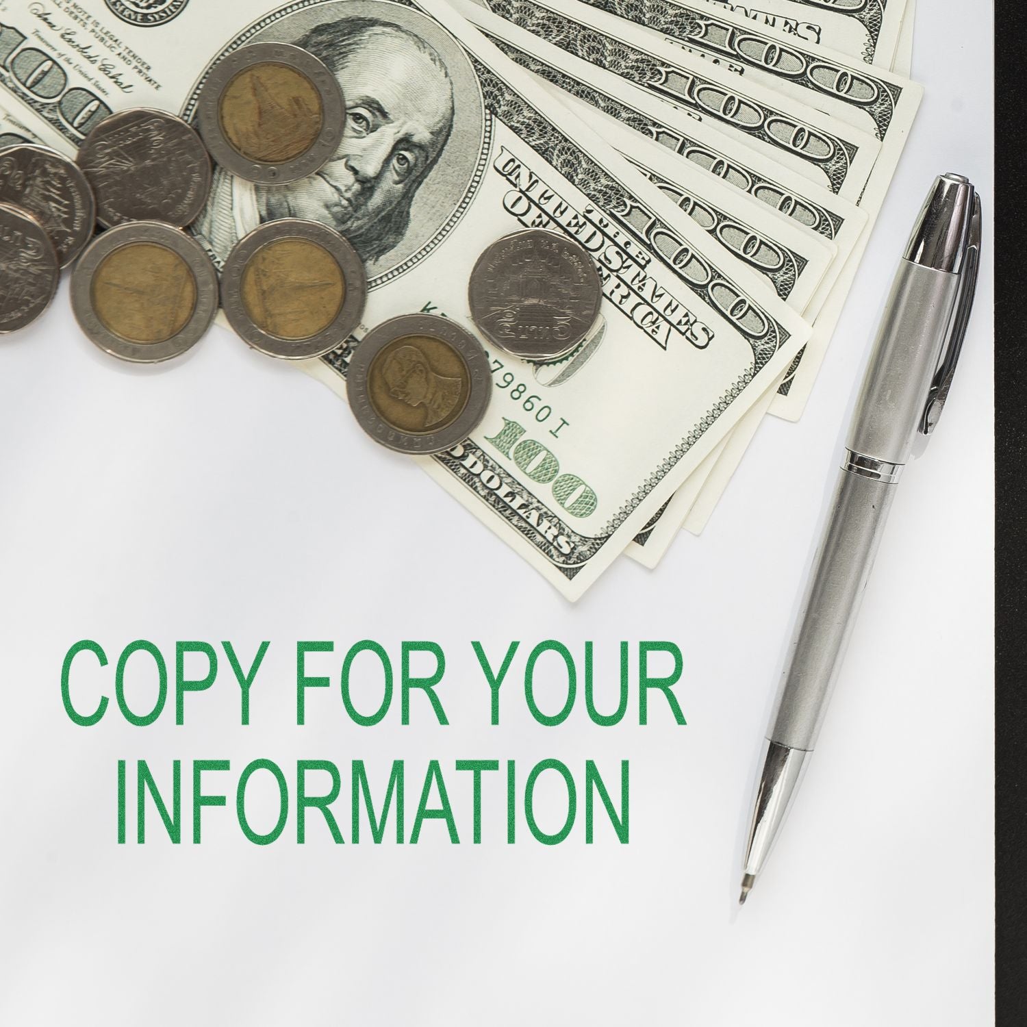 Self Inking Copy For Your Information Stamp used on paper with pen, coins, and dollar bills in the background.