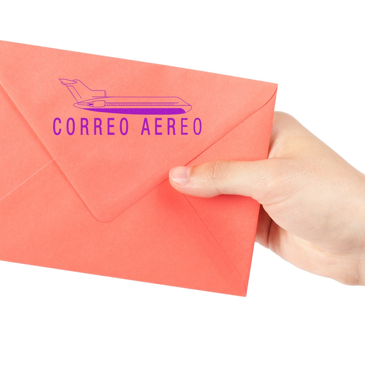 A hand holding a red envelope stamped with the Large Correo Aero Rubber Stamp, featuring a purple airplane and text CORREO AEREO .