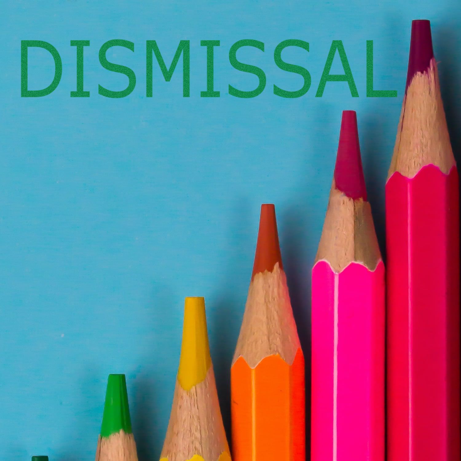 Colorful pencils arranged in ascending order with the word DISMISSAL above them, showcasing the Large Dismissal Rubber Stamp in use.