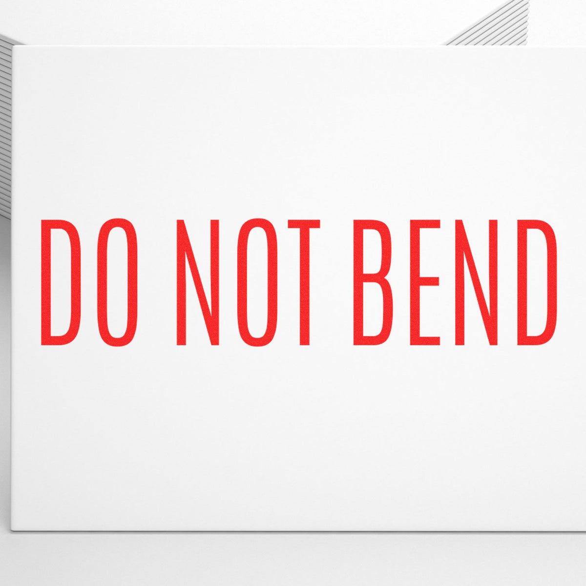 Do Not Bend Rubber Stamp In Use Photo