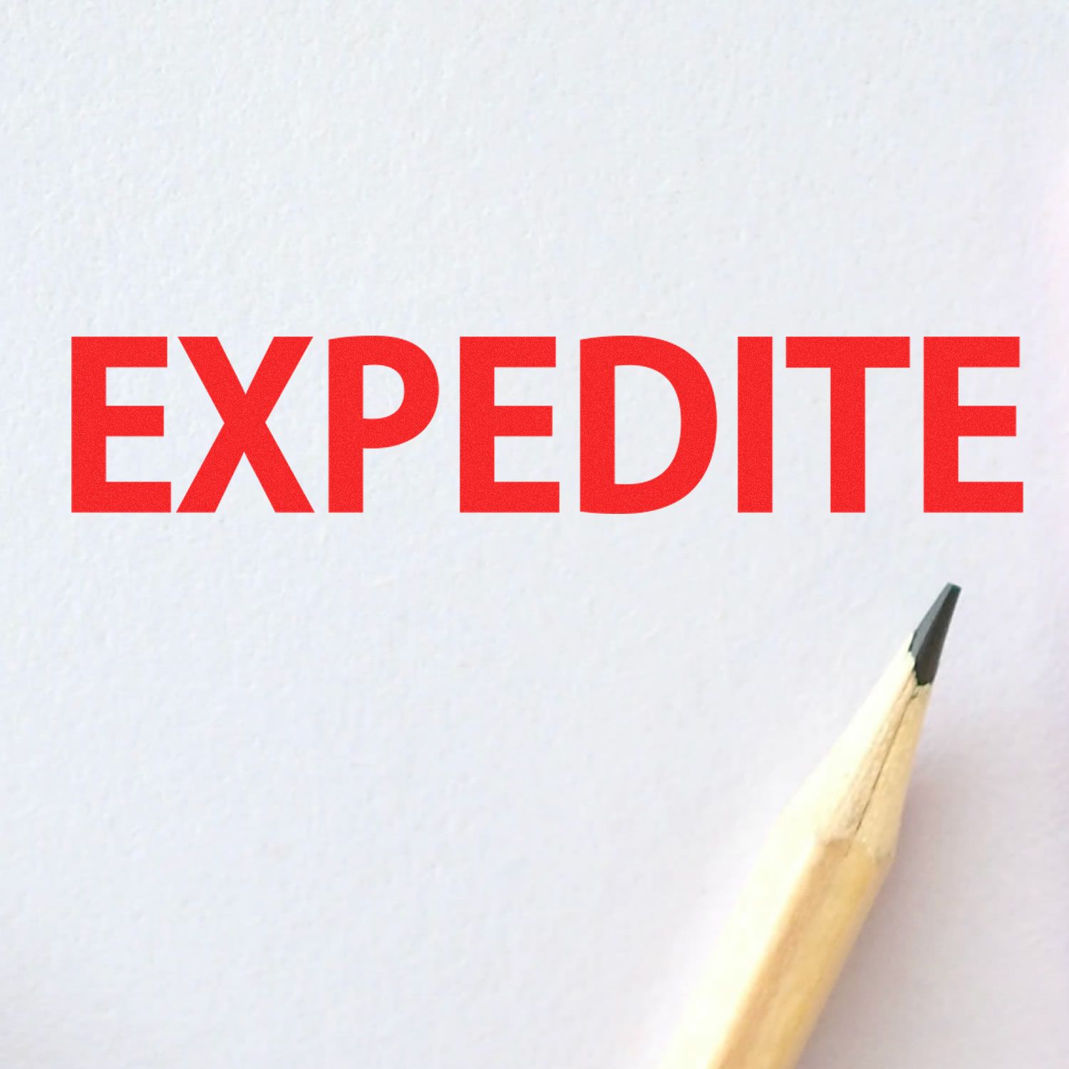 Large Expedite Rubber Stamp in use, showing the word EXPEDITE stamped in red ink on white paper, with a pencil tip nearby.