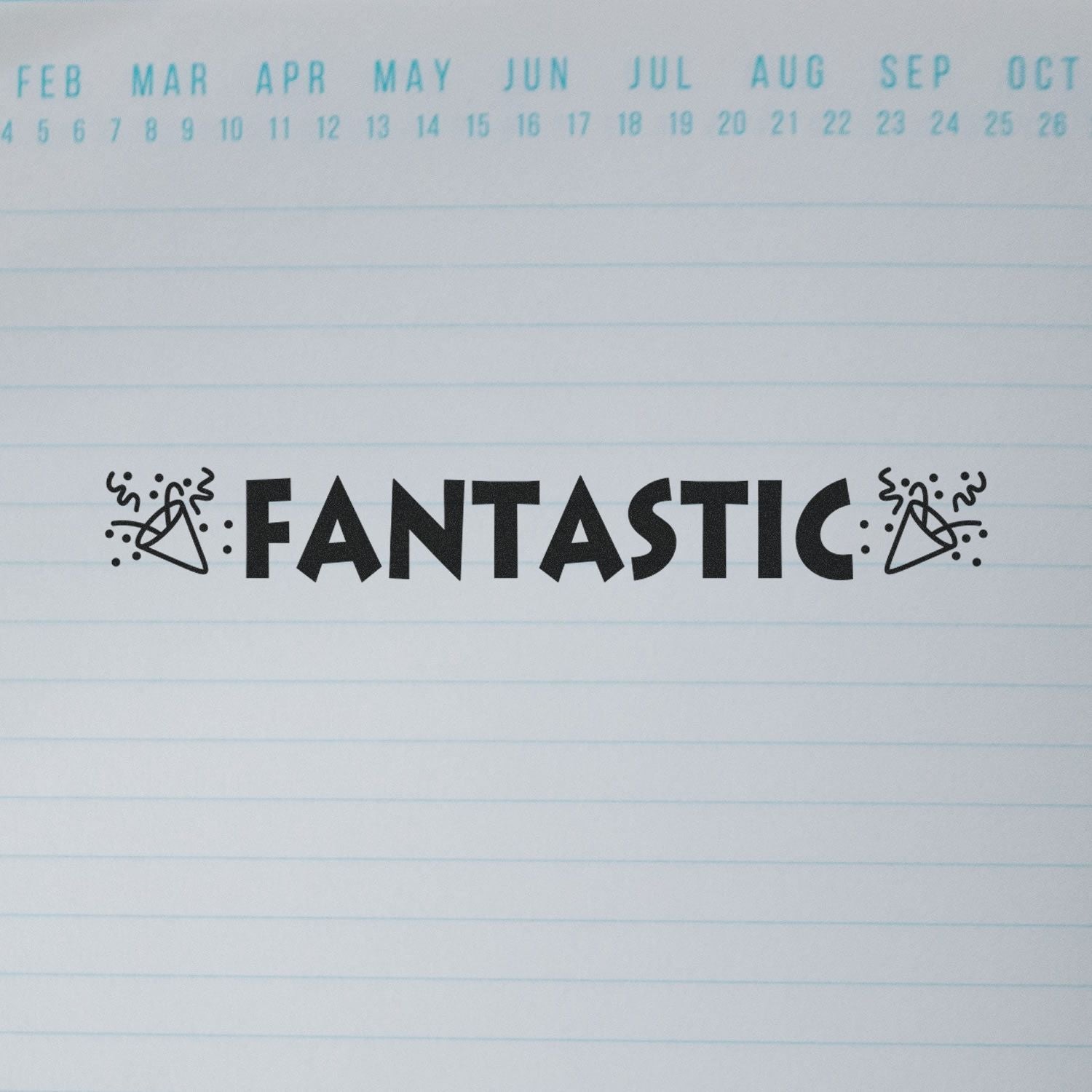 Slim Pre-Inked Fantastic with Icons Stamp used on a lined paper with months listed at the top, showing the word Fantastic with party icons.