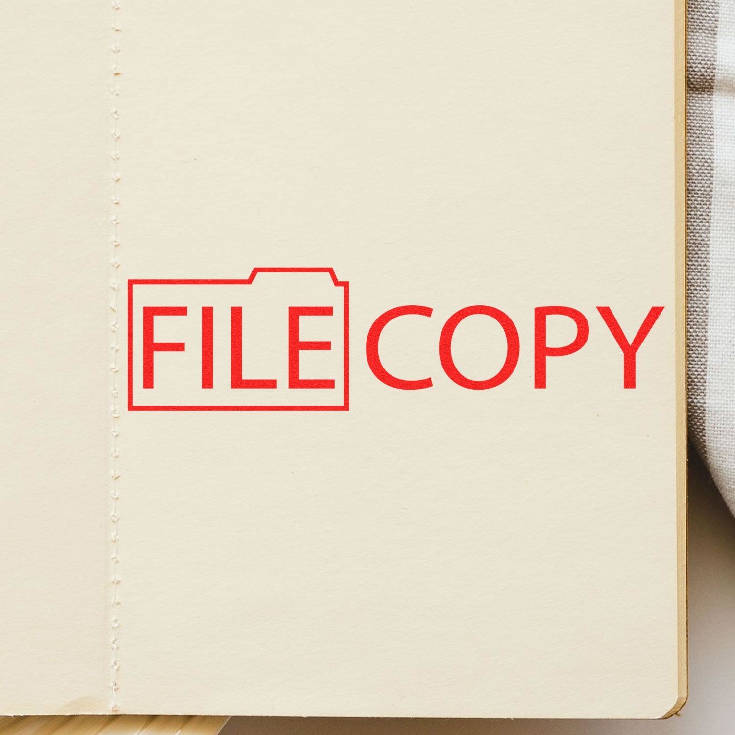 Slim Pre-Inked File Copy with Folder Stamp in red ink on a beige folder, emphasizing document organization and management.