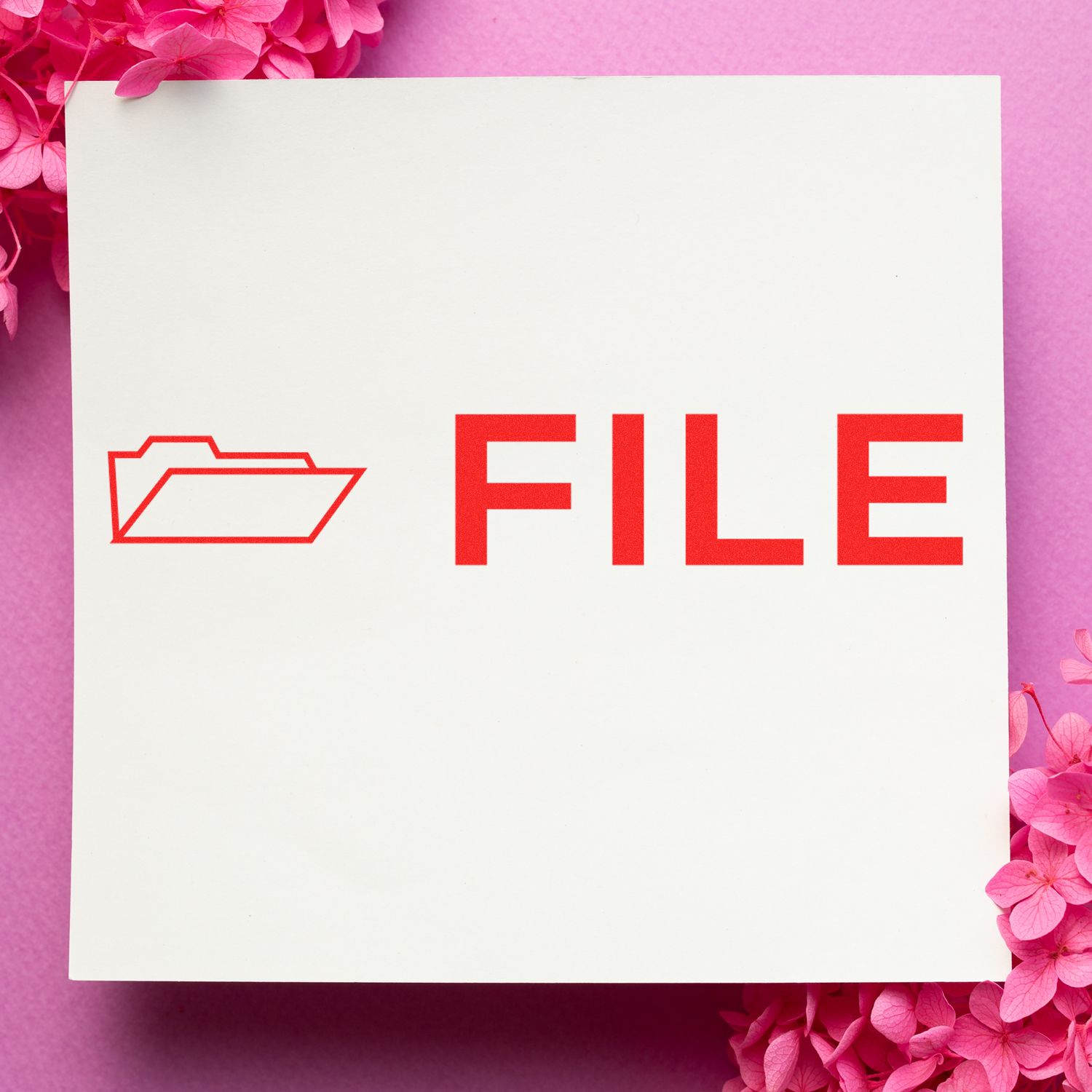 Large File with Envelope Rubber Stamp in use, displaying a red file icon and the word FILE on white paper, surrounded by pink flowers.