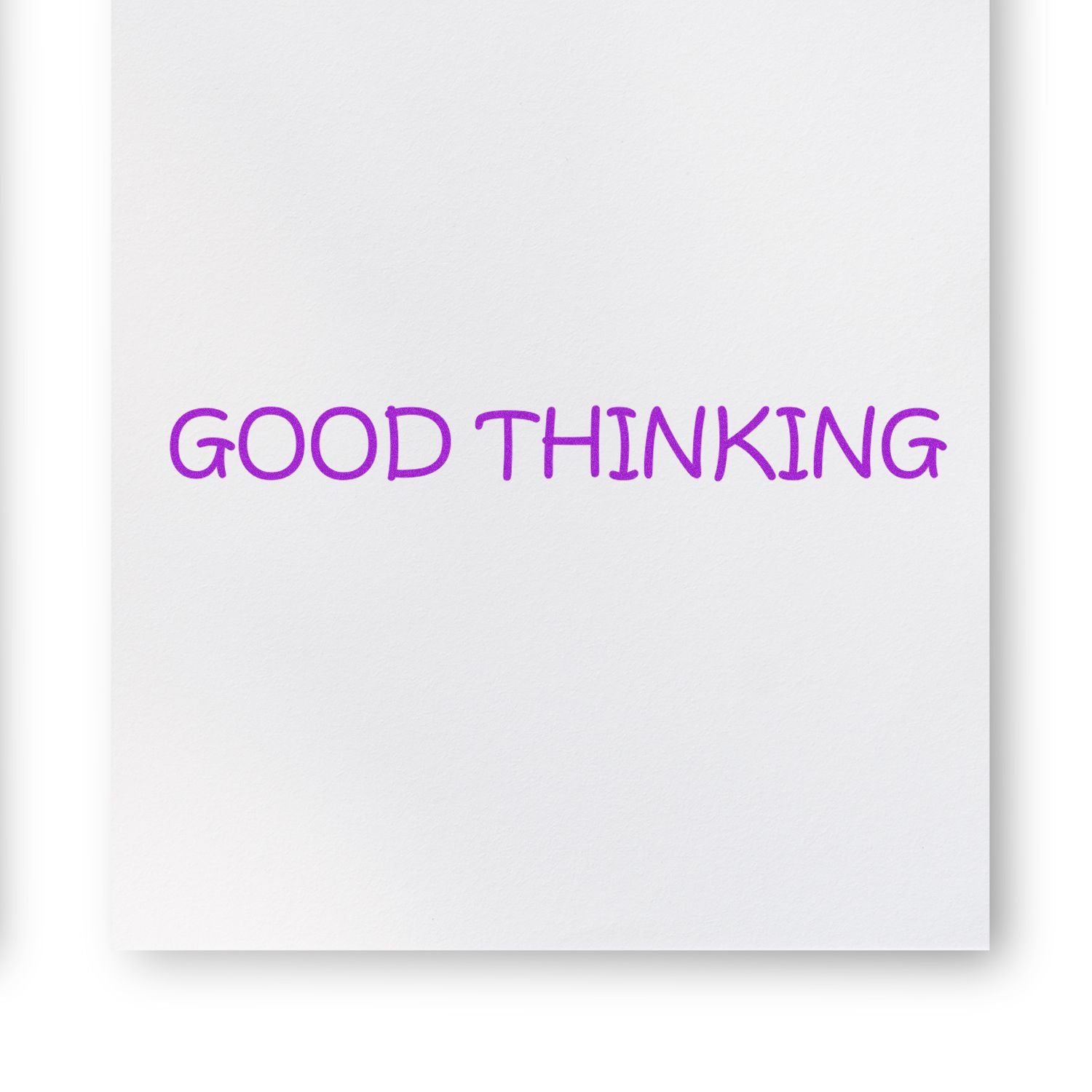 Paper stamped with 'GOOD THINKING' in purple ink using the Slim Pre-Inked Good Thinking Stamp.