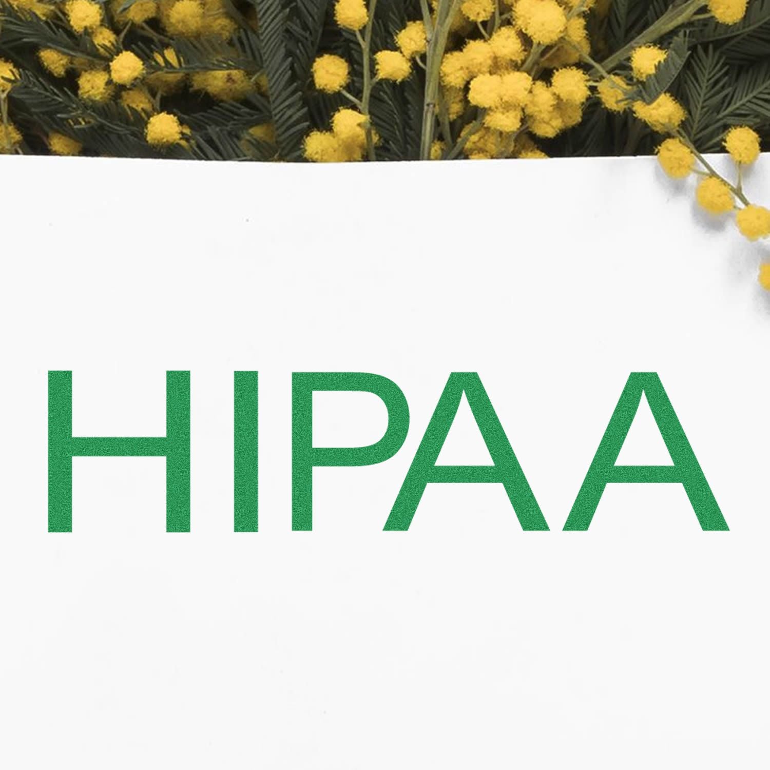 HIPAA Medical Rubber Stamp in green ink on white paper, with yellow flowers in the background.